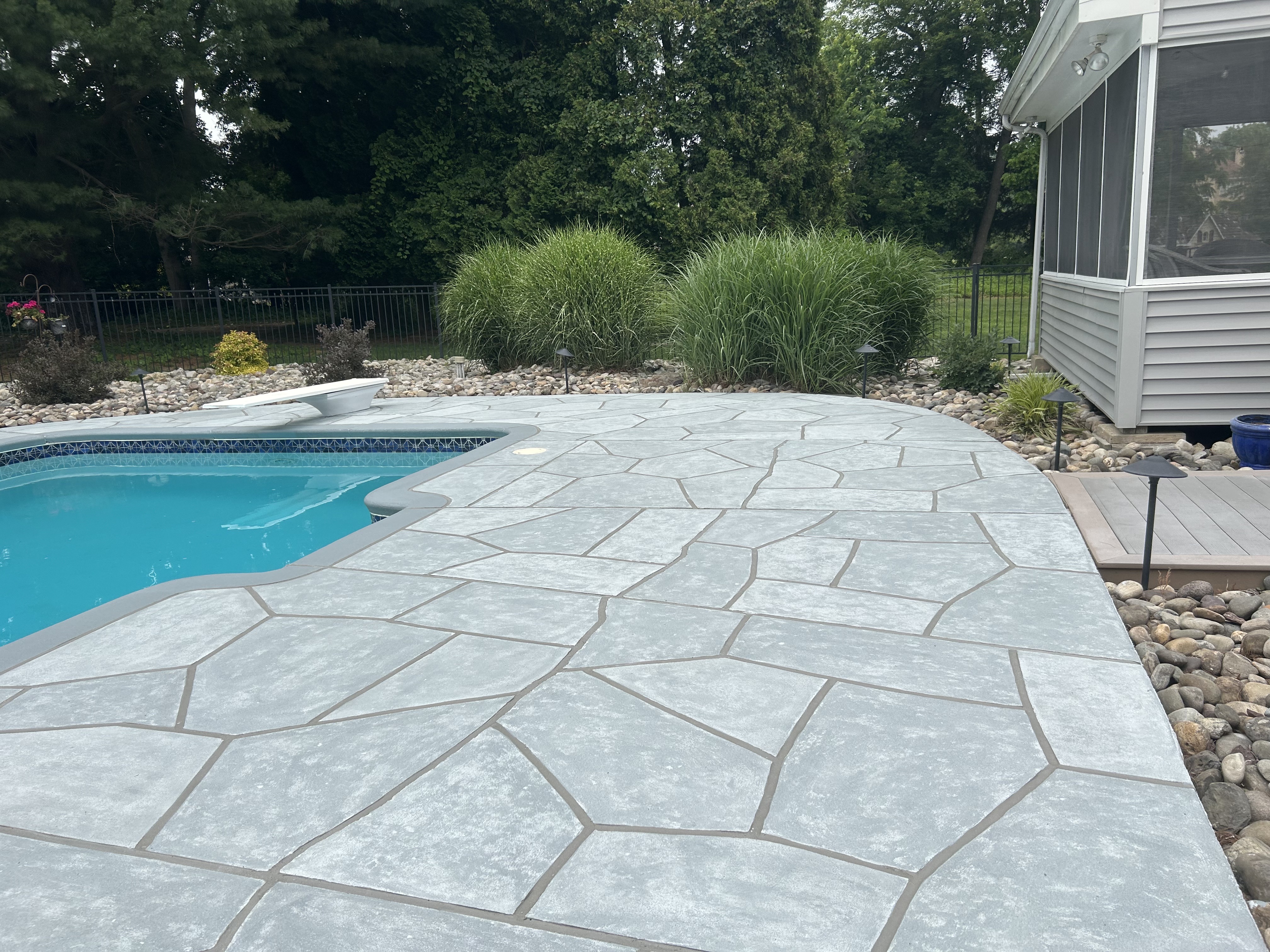 Granite Boulder concrete pool deck repair featuring textured stone surface in Providence, RI