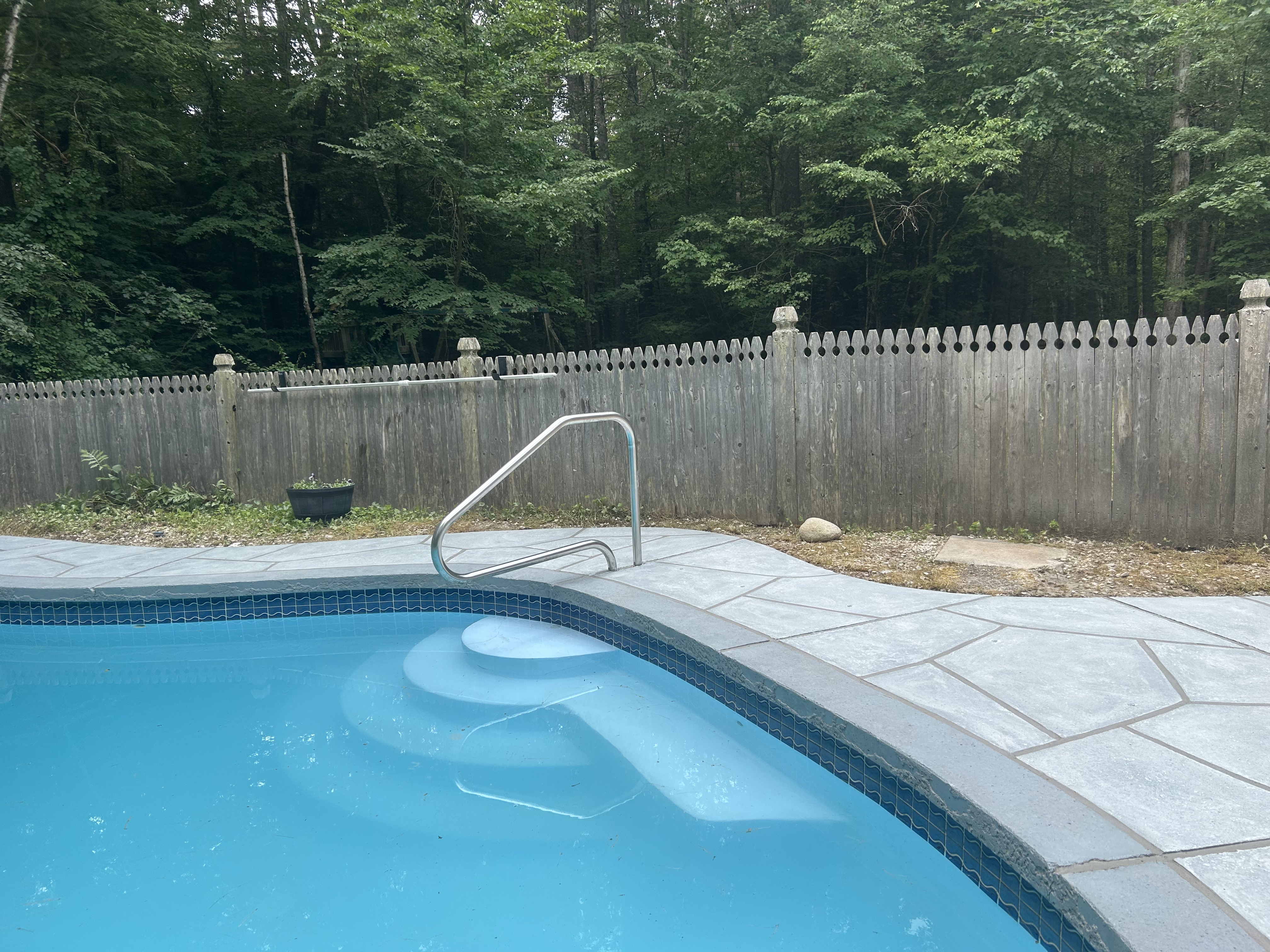 Granite Boulder pool deck renovation displaying bold granite-style aesthetic in Plymouth, MA