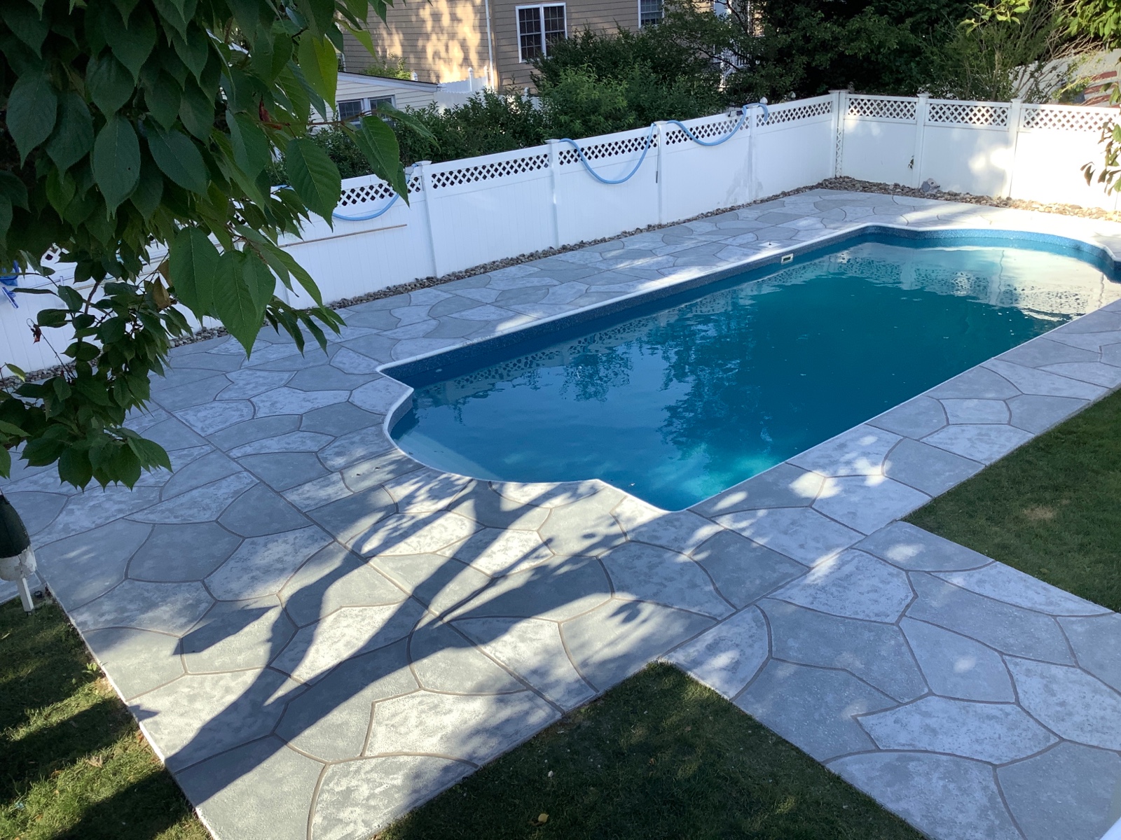 Pool deck resurfaced in Granite Boulder finish with rugged stone-like texture in Summit, NJ