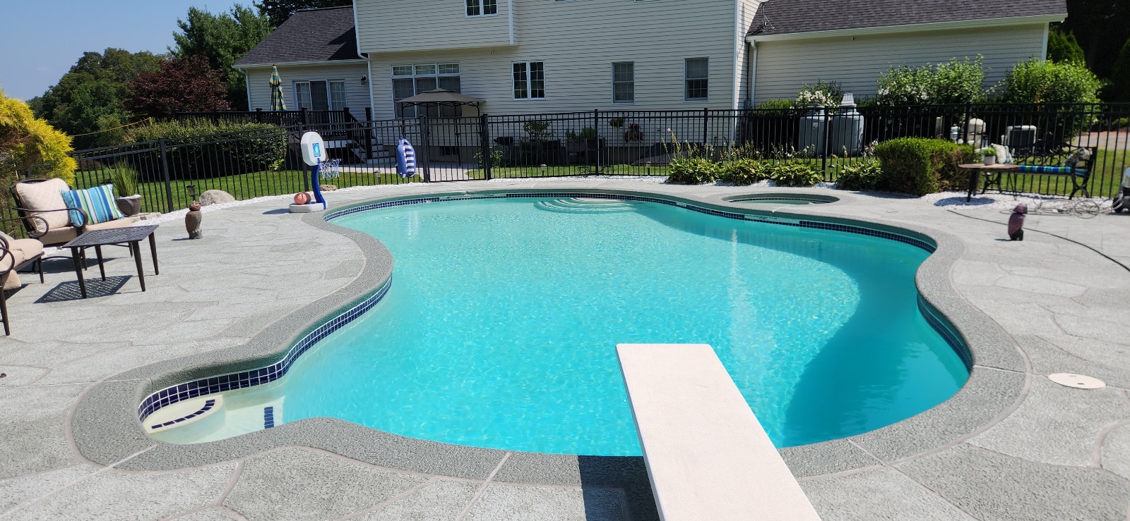 Granite Boulder concrete pool deck repair featuring deep gray granite tones
