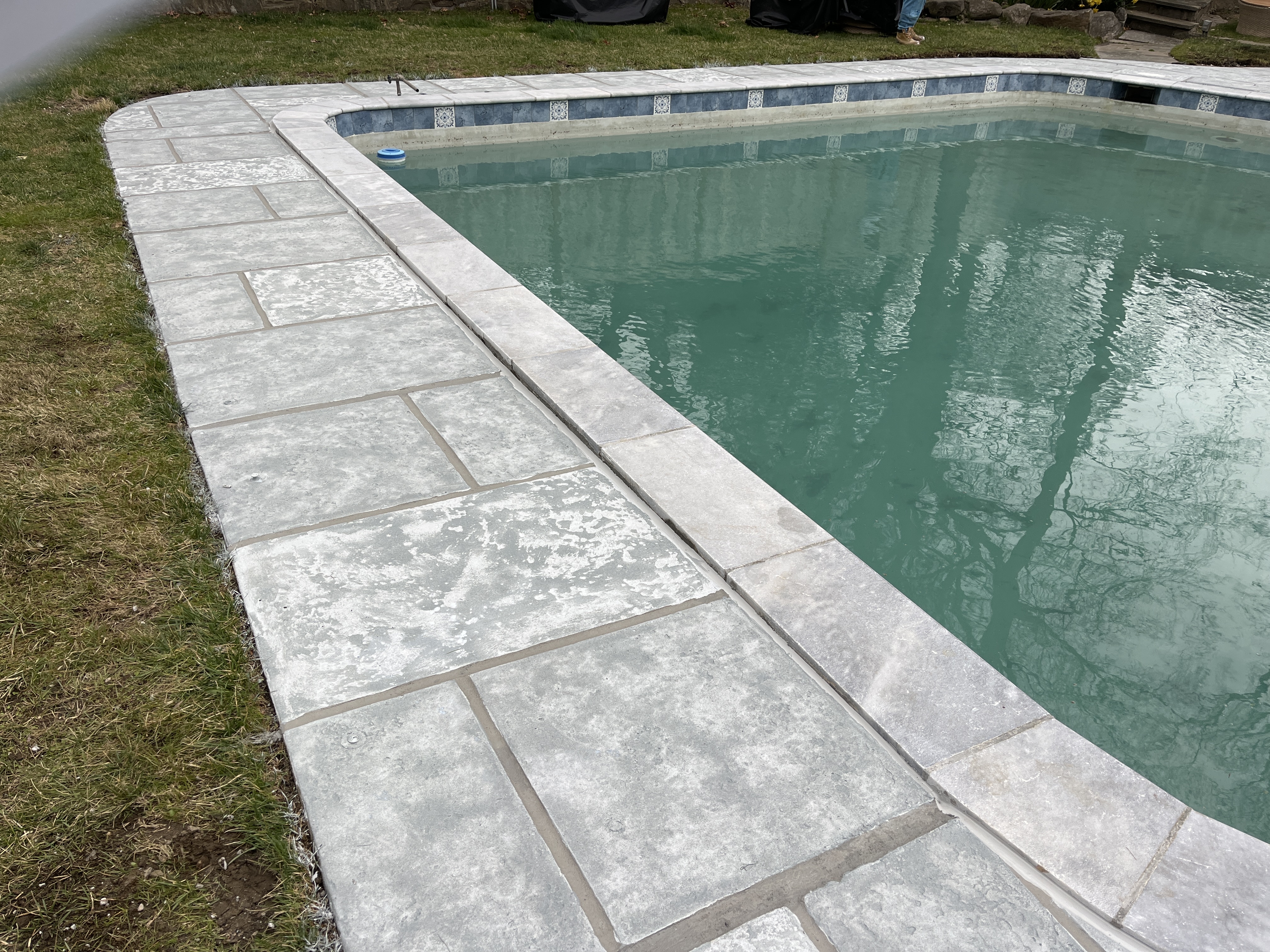 Granite Boulder tile style pool deck concrete resurfacing with refined stone texture