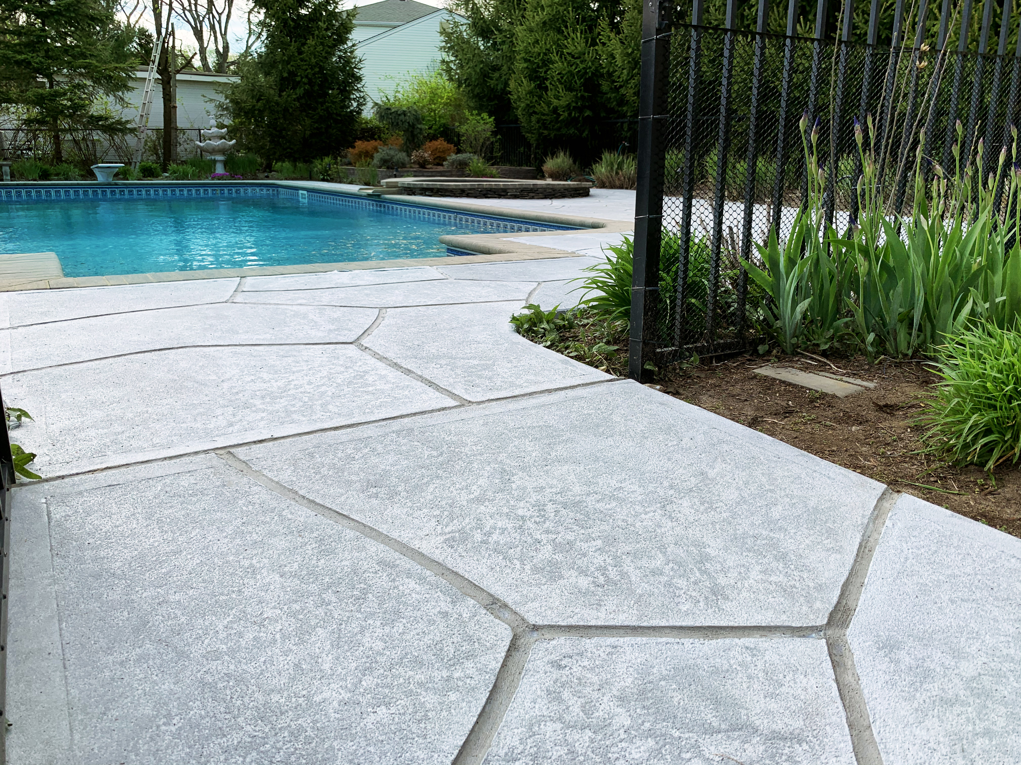 Granite Boulder concrete pool deck repair featuring natural boulder-inspired appearance