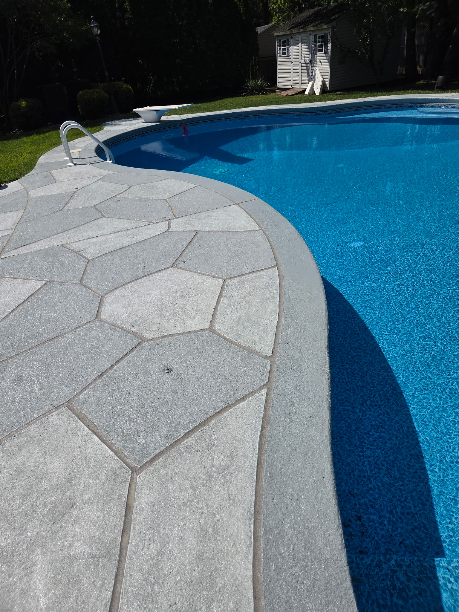 Granite Boulder concrete pool deck repair featuring natural boulder-inspired appearance in Princeton, NJ
