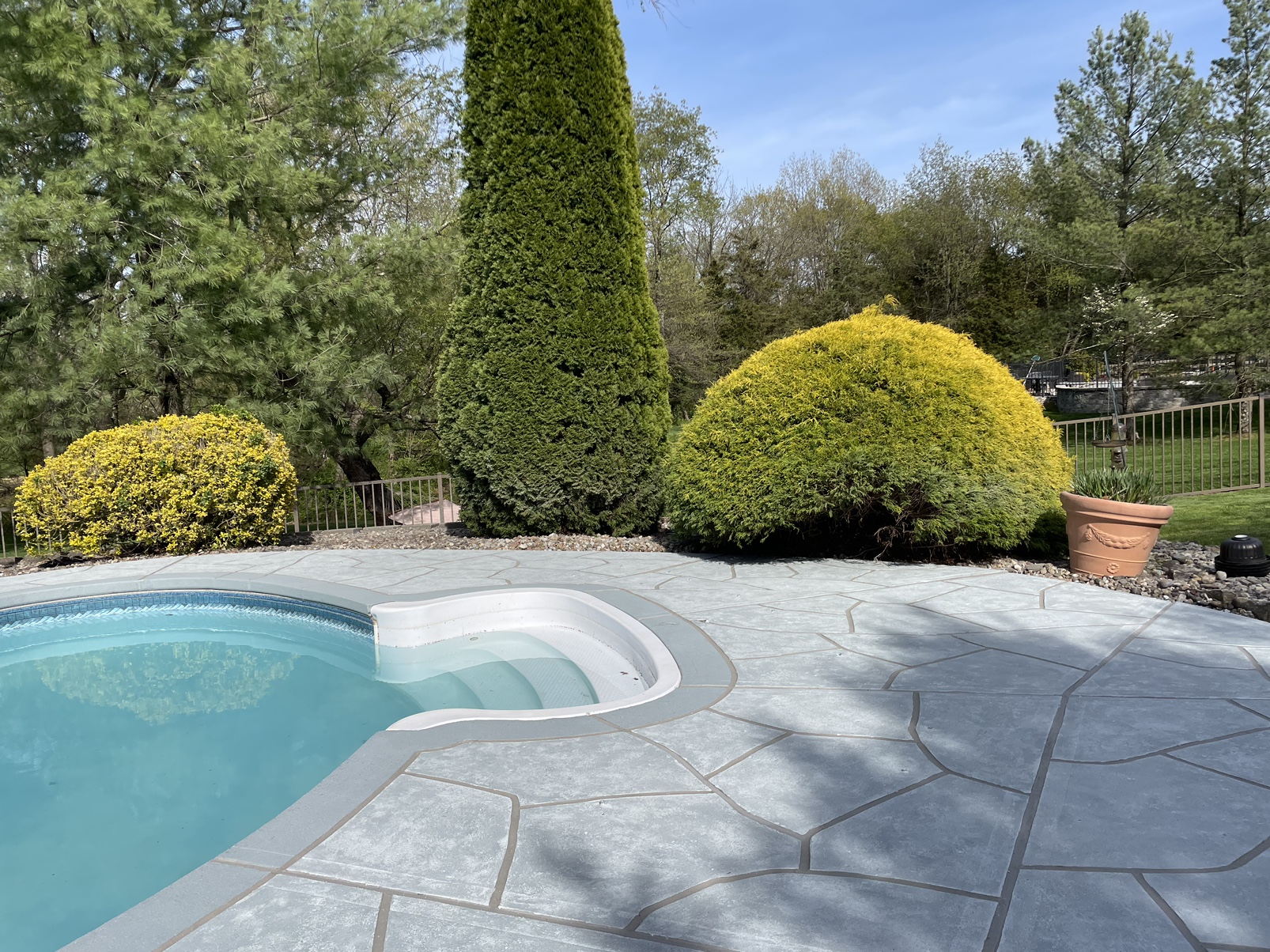 Granite Boulder concrete pool deck repair featuring durable resurfaced concrete in Providence, RI