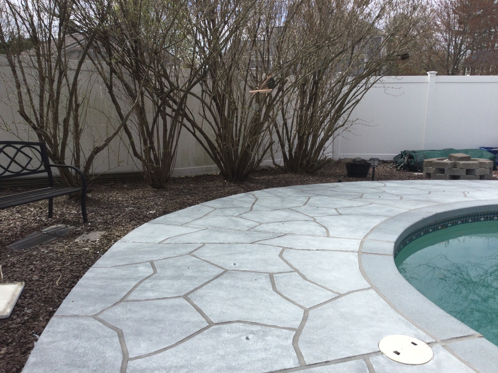 Granite Boulder concrete pool deck repair featuring textured stone surface