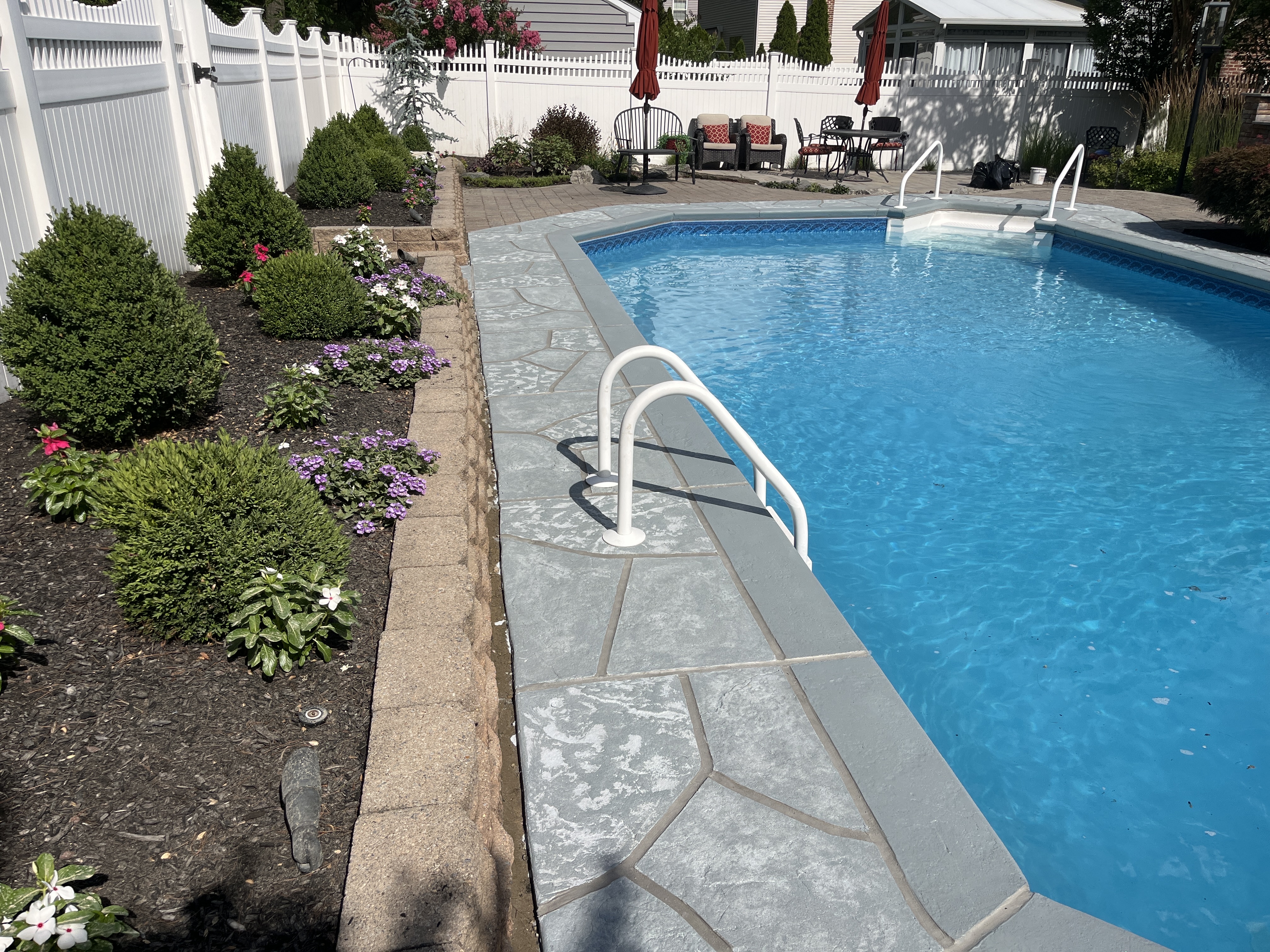 Granite Boulder concrete pool deck repair featuring durable resurfaced concrete