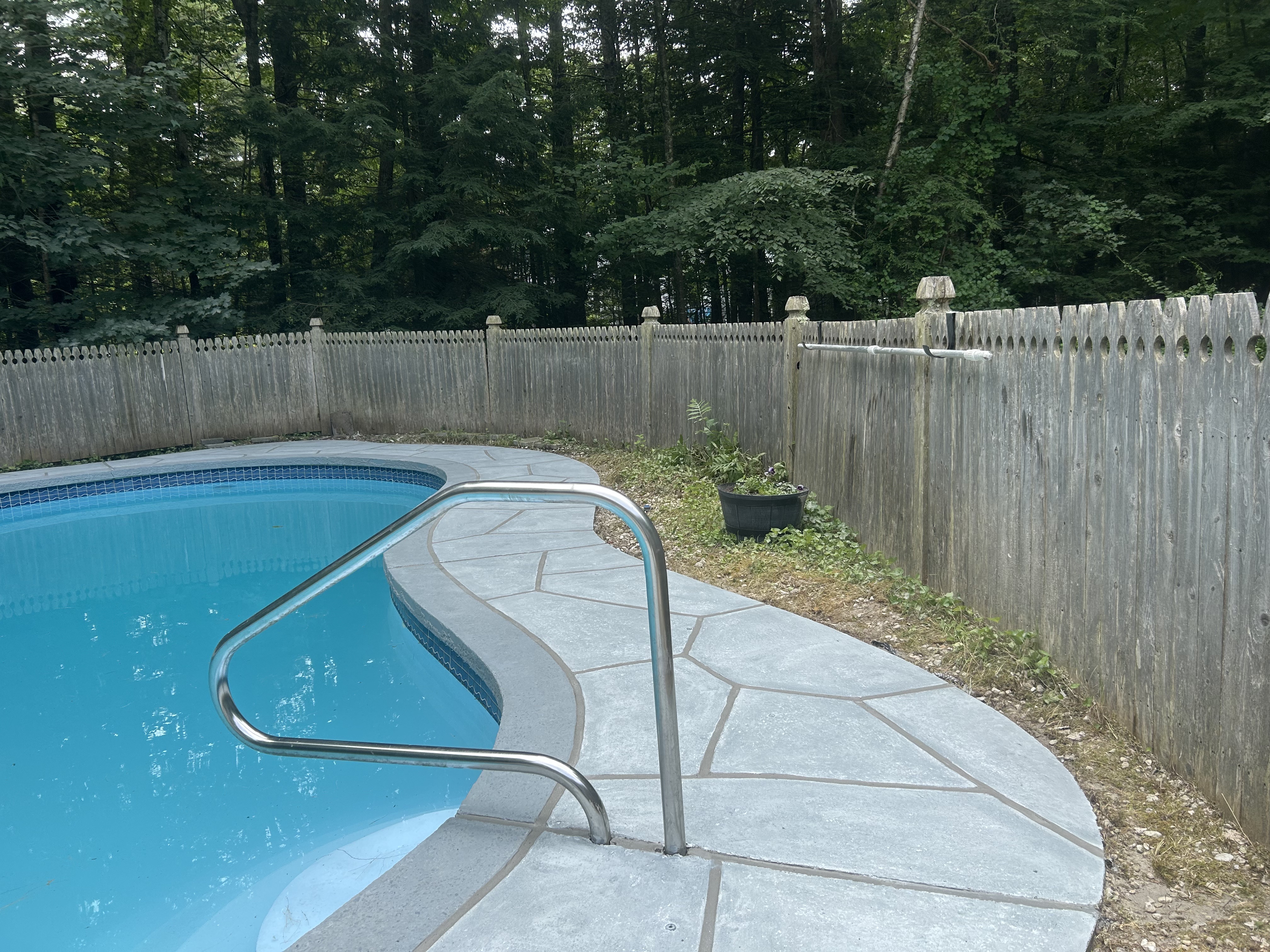 Granite Boulder concrete pool deck repair featuring textured stone surface