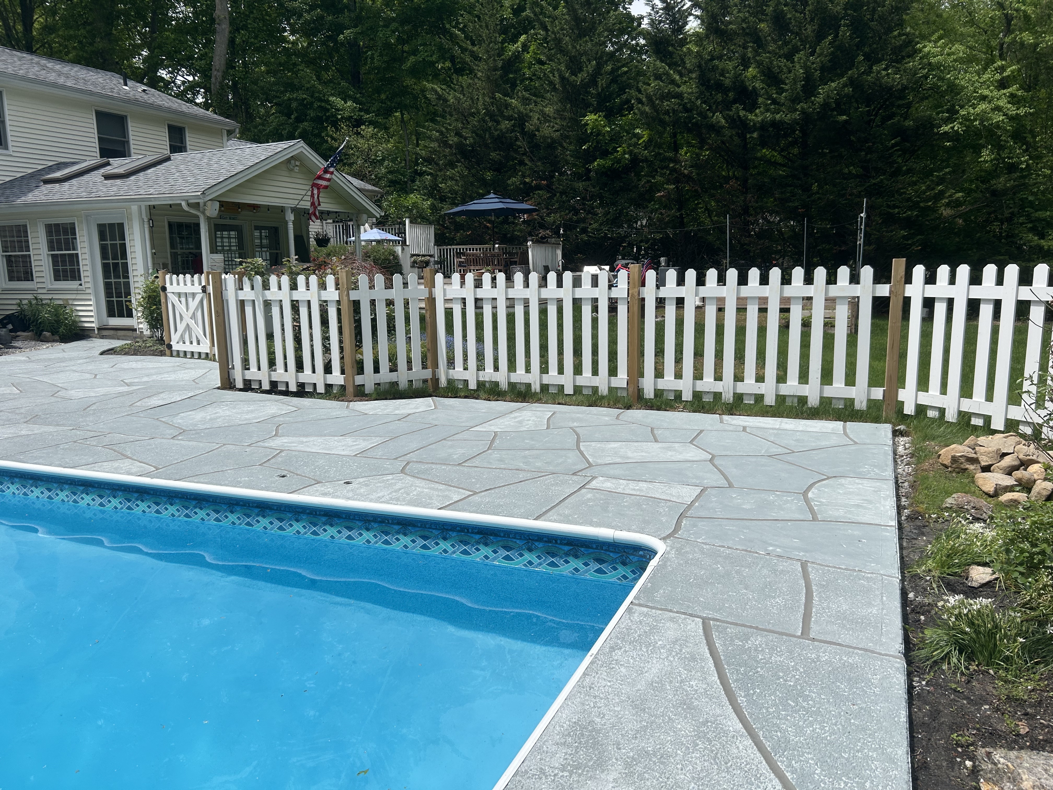Granite Boulder pool deck renovation displaying durable resurfaced concrete