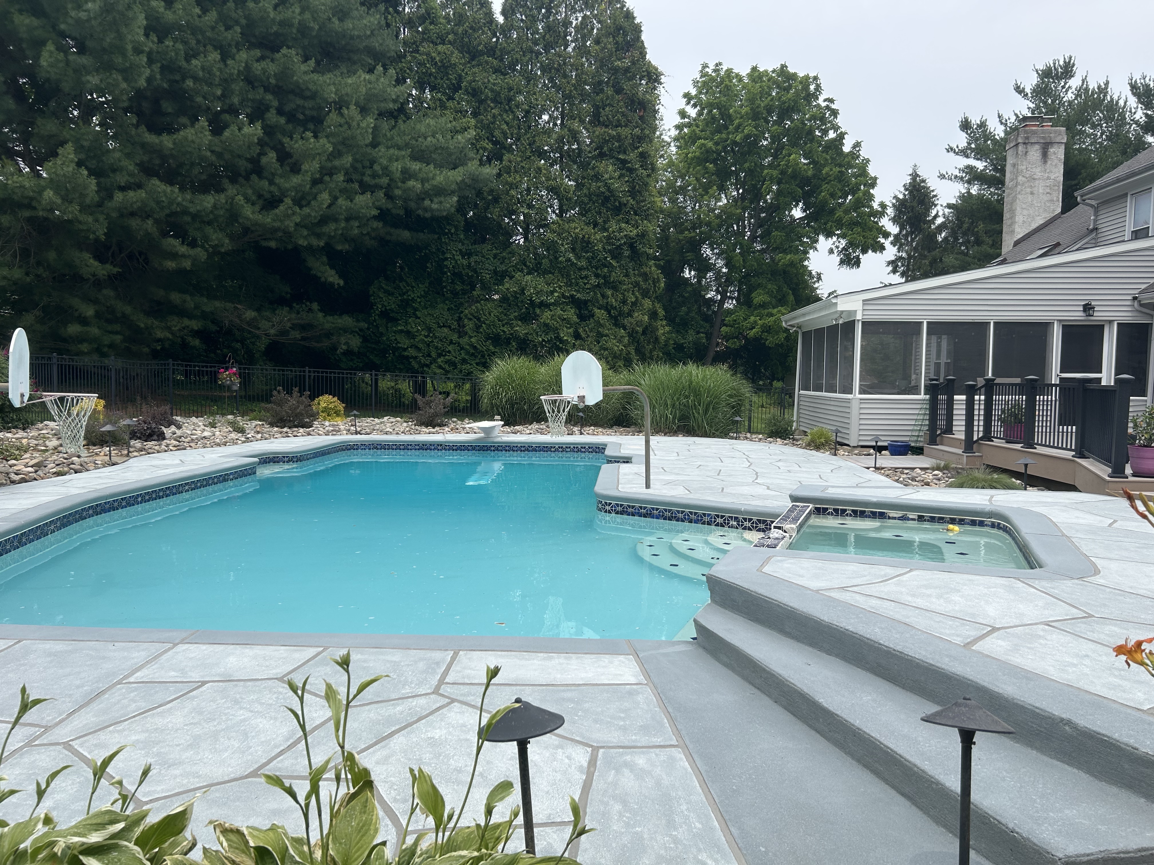 Granite Boulder concrete pool deck repair featuring durable resurfaced concrete in Doylestown, PA