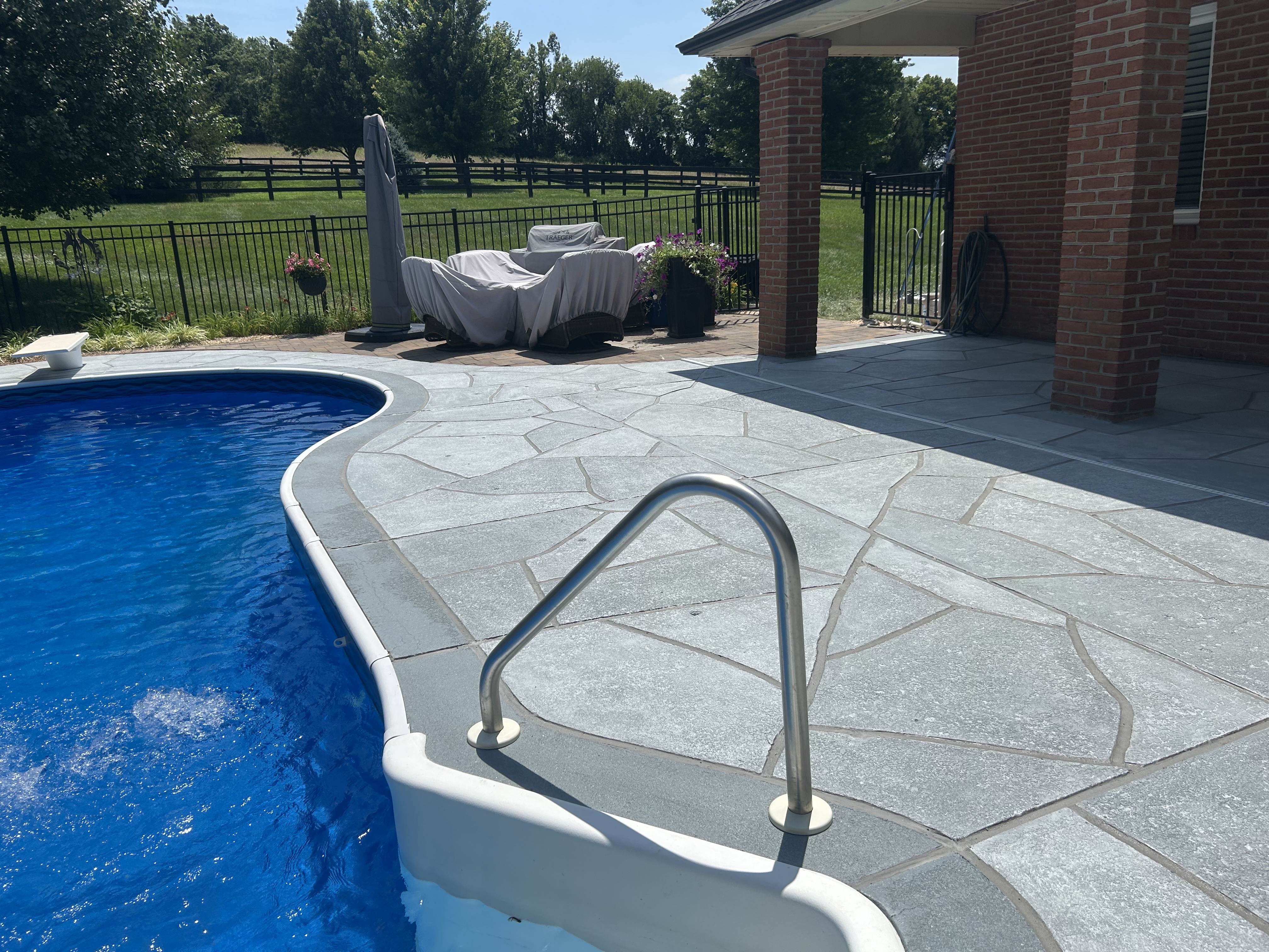 Granite Boulder concrete pool deck repair featuring deep gray granite tones in Princeton, NJ