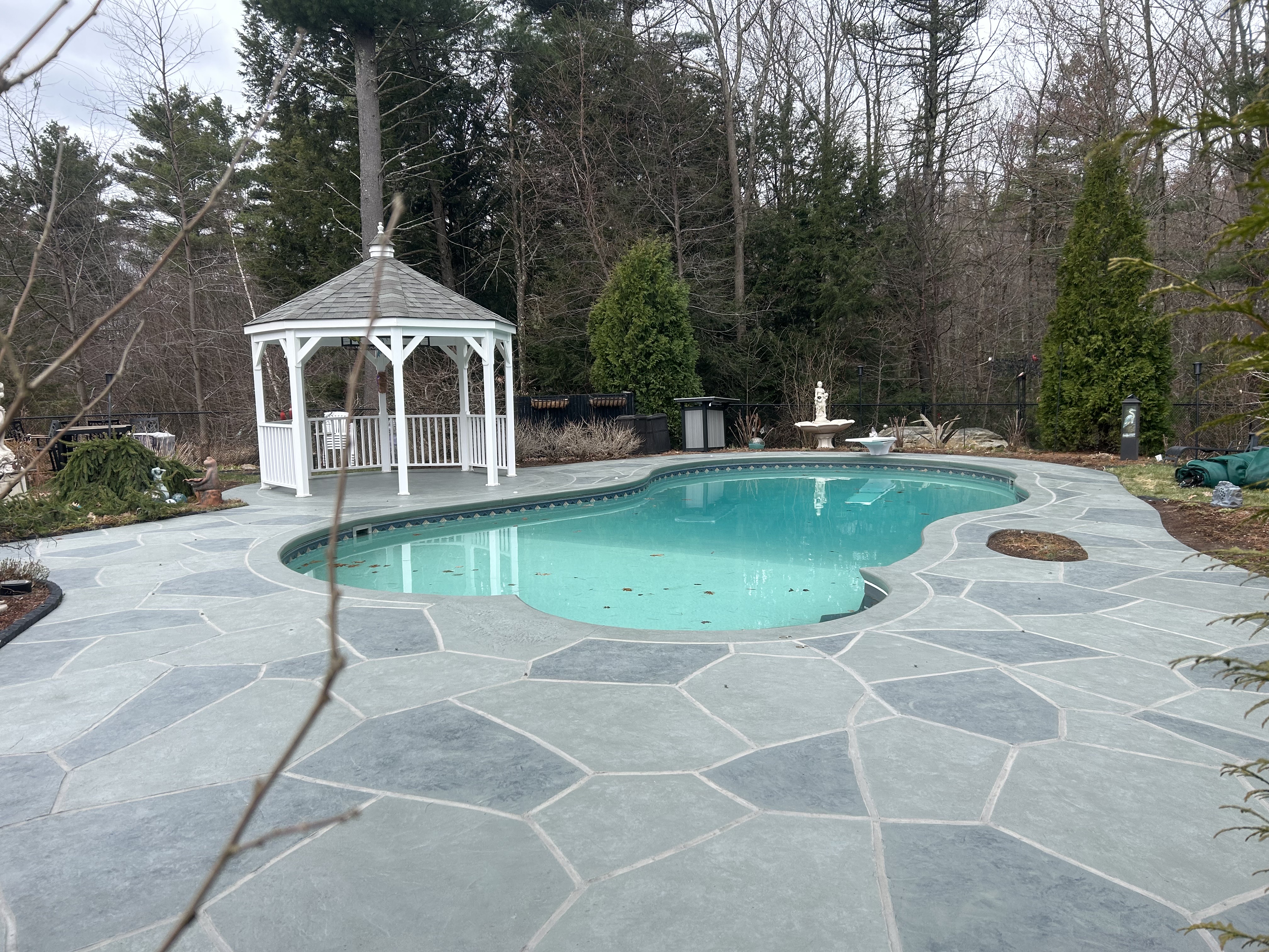 Granite Slate decorative concrete pool deck surface with stone inspired pattern.