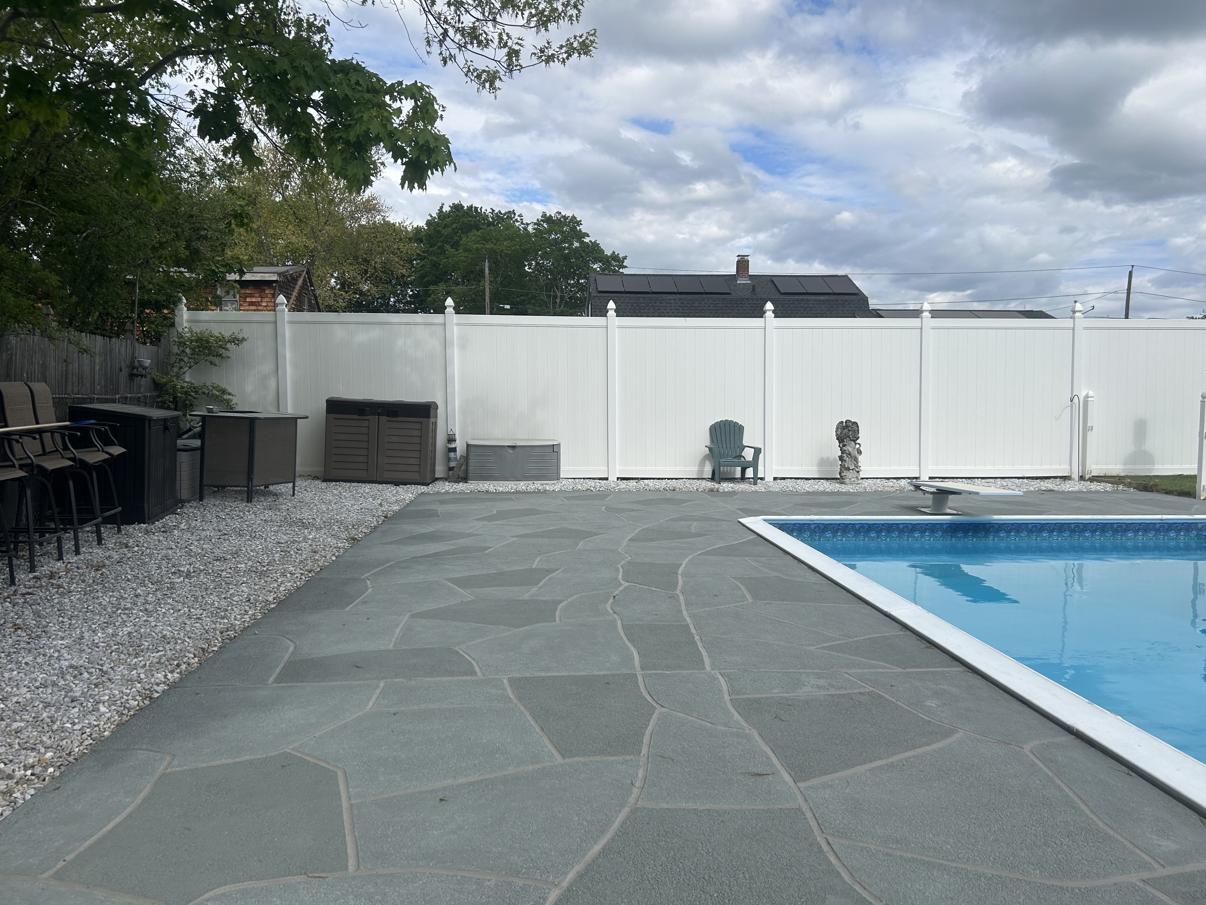 Residential pool deck in Granite Slate color theme after concrete resurfacing.