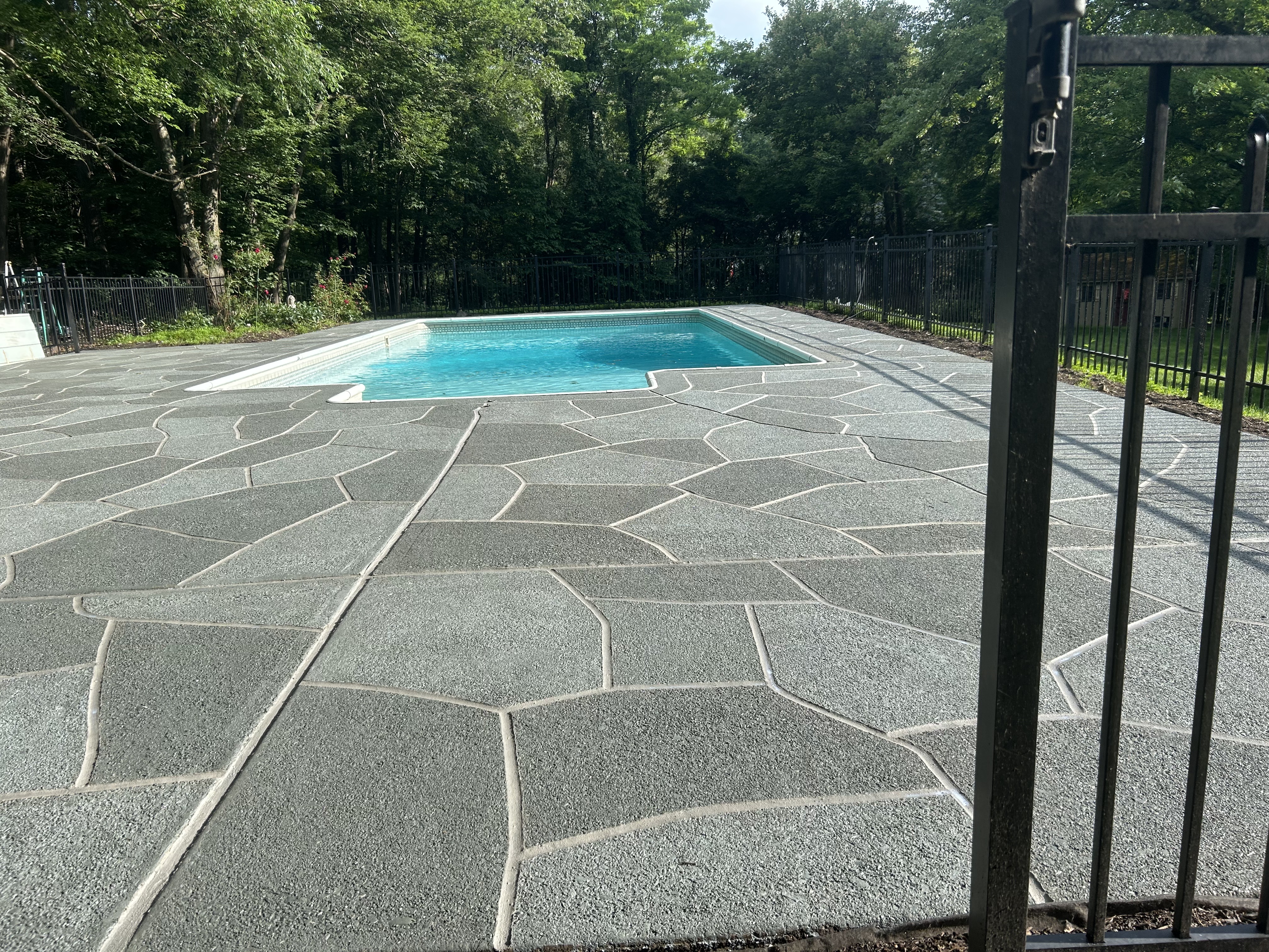 Granite Slate pool deck concrete repair and resurfacing project.
