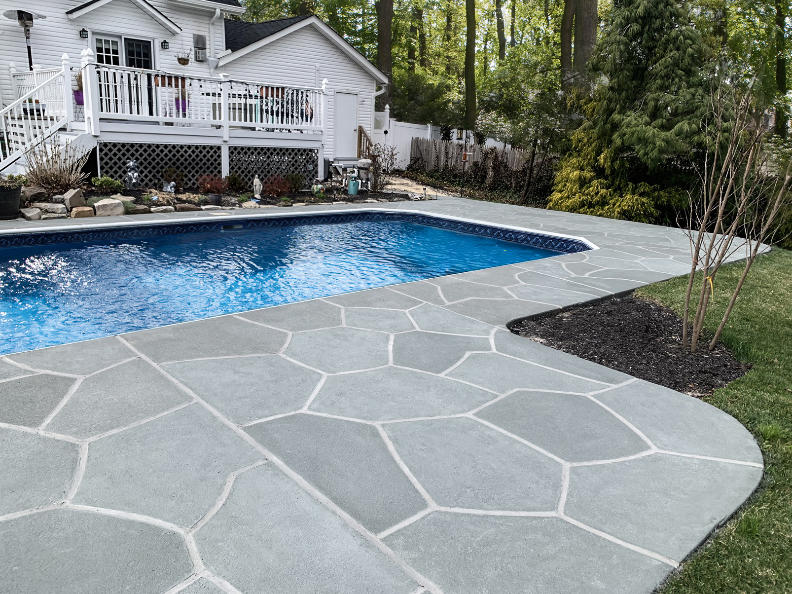 Granite Slate decorative concrete pool deck surface with stone inspired pattern.