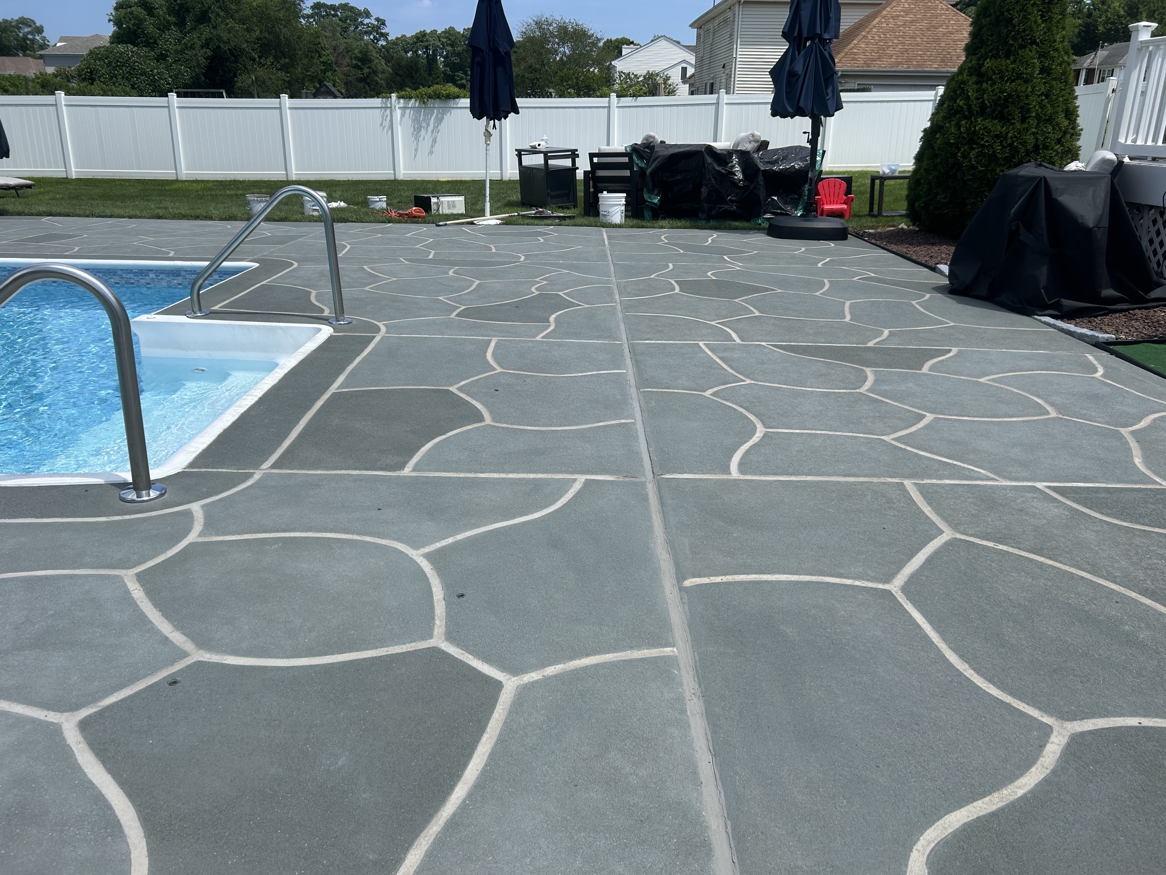 Granite Slate decorative concrete pool deck surface with stone inspired pattern.