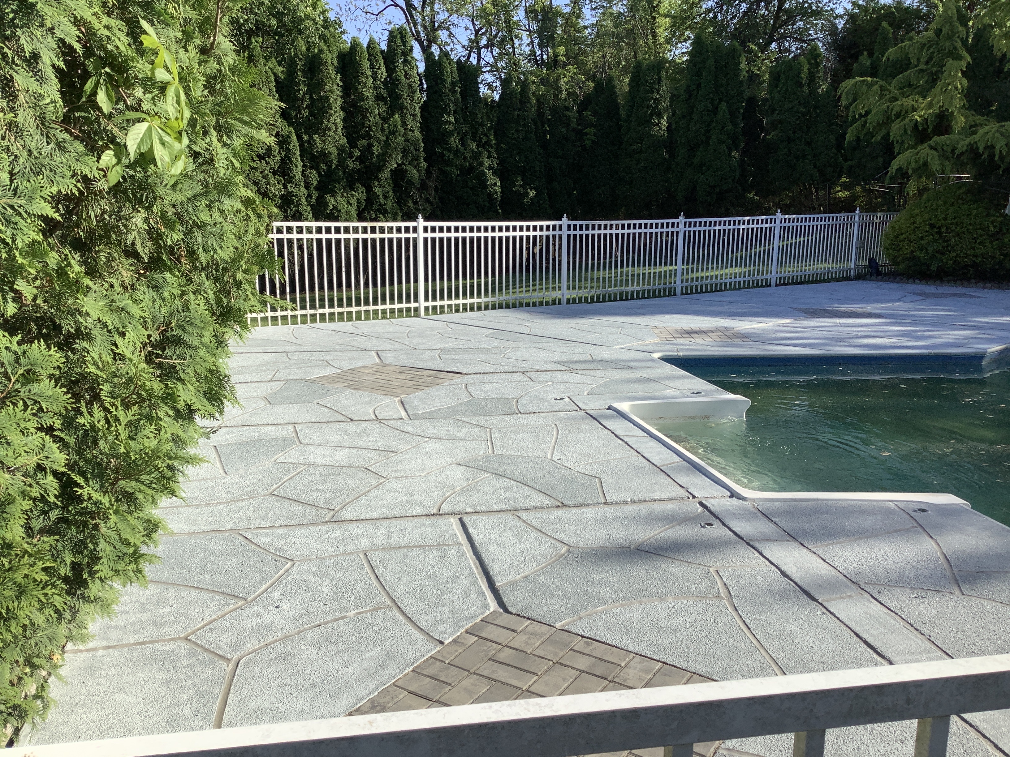 Granite Boulder concrete pool deck repair featuring natural boulder-inspired appearance