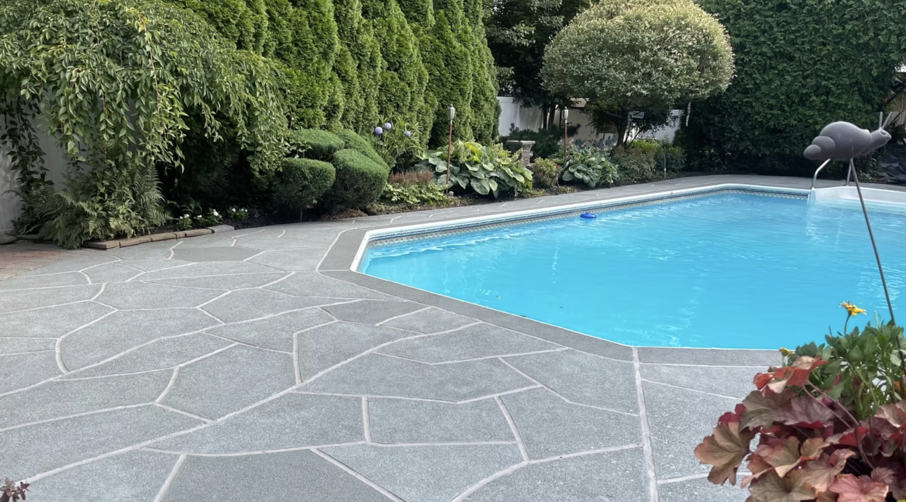 Granite Slate decorative concrete pool deck resurfacing with refined gray stone appearance
