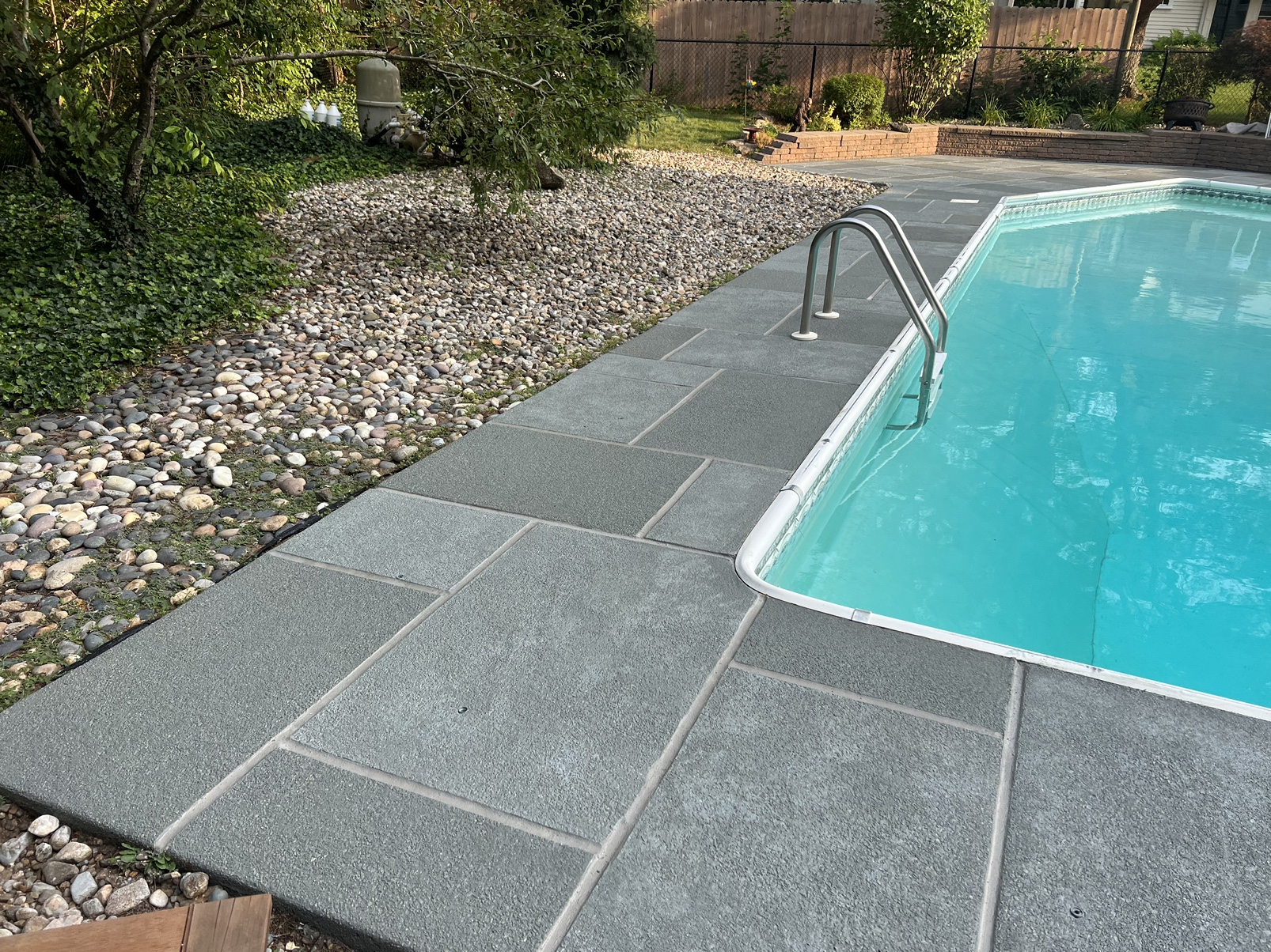 Granite Slate tile style decorative concrete pool deck project in residential setting