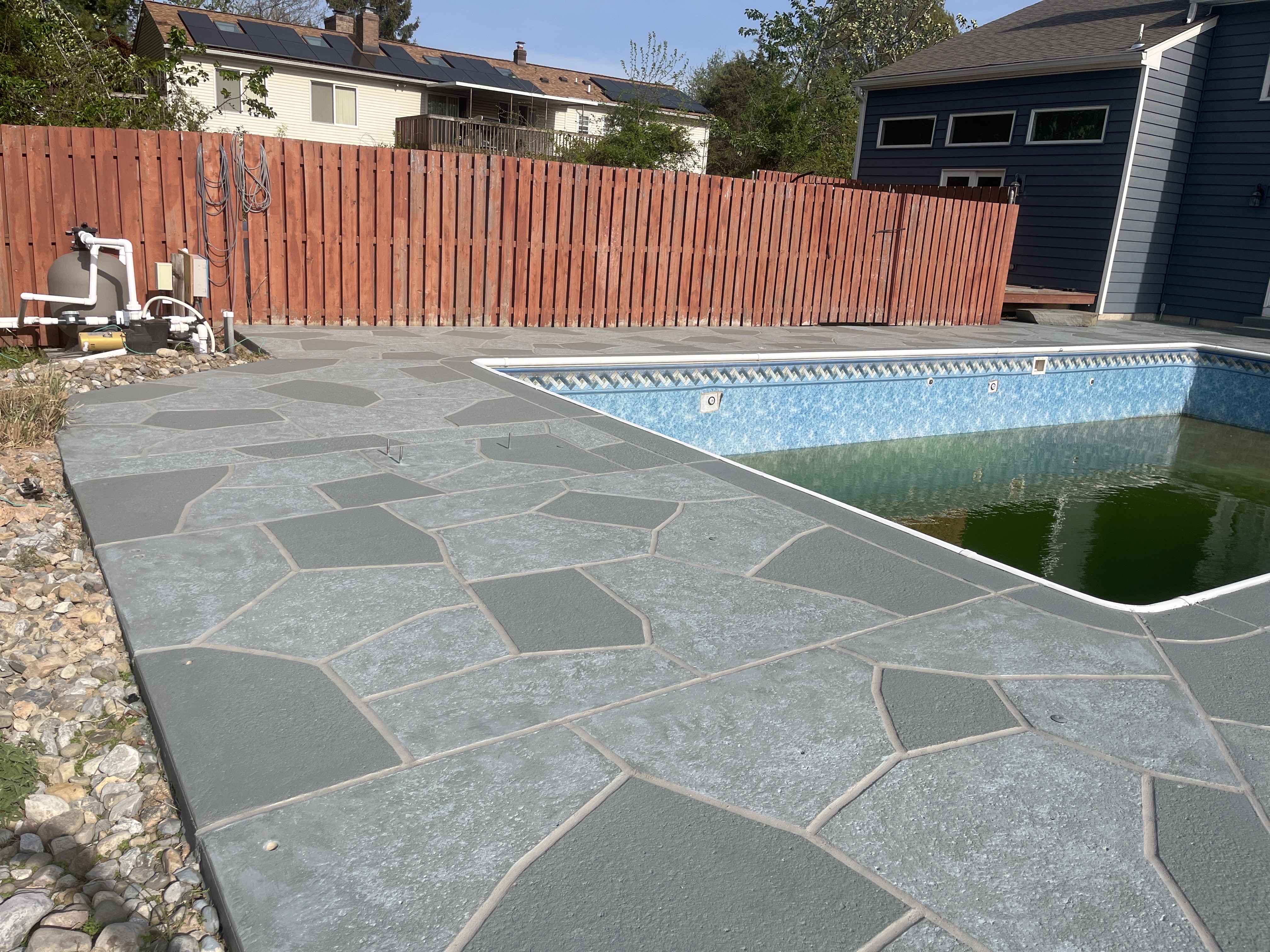 Granite Slate decorative concrete pool deck surface with stone inspired pattern.