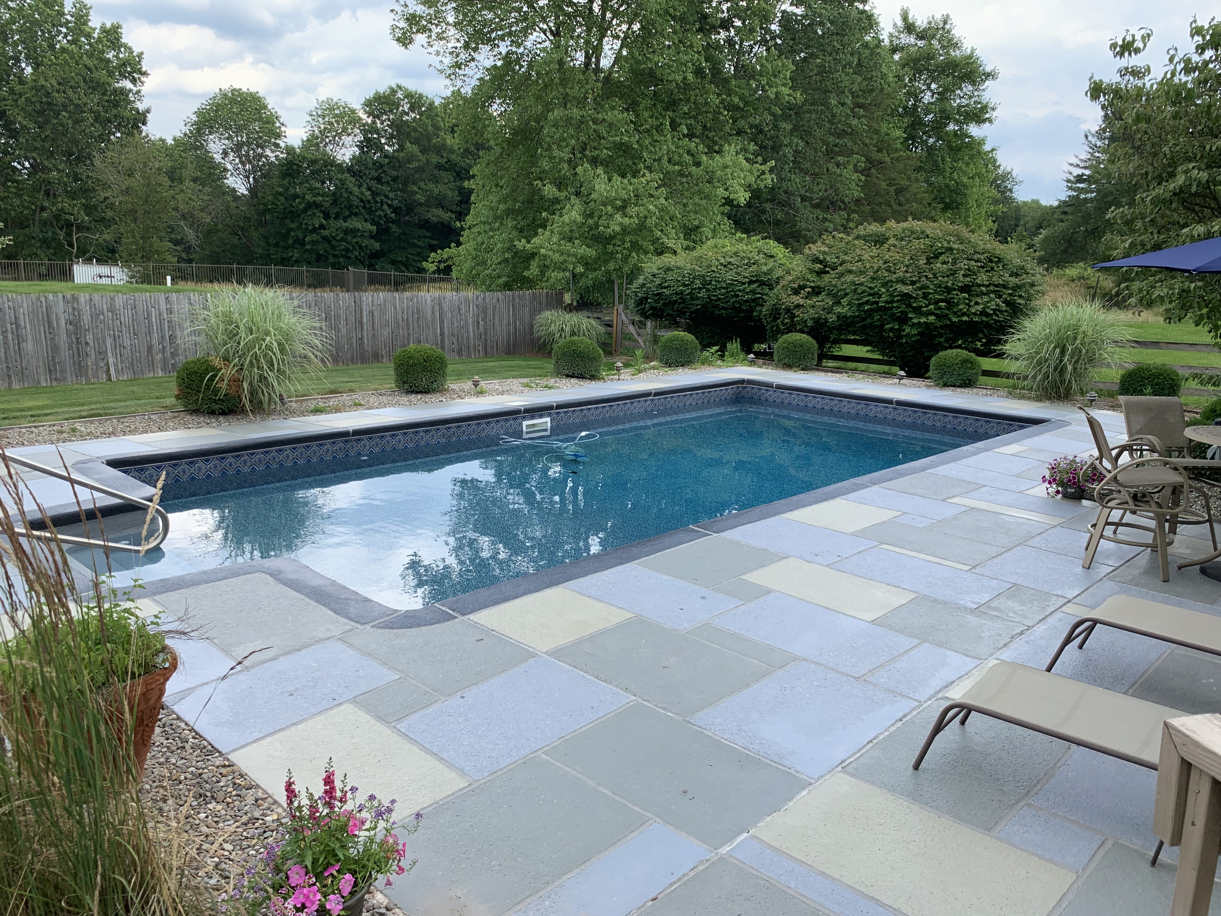 Residential pool deck in Granite Slate color theme in Summit, NJ after concrete resurfacing.