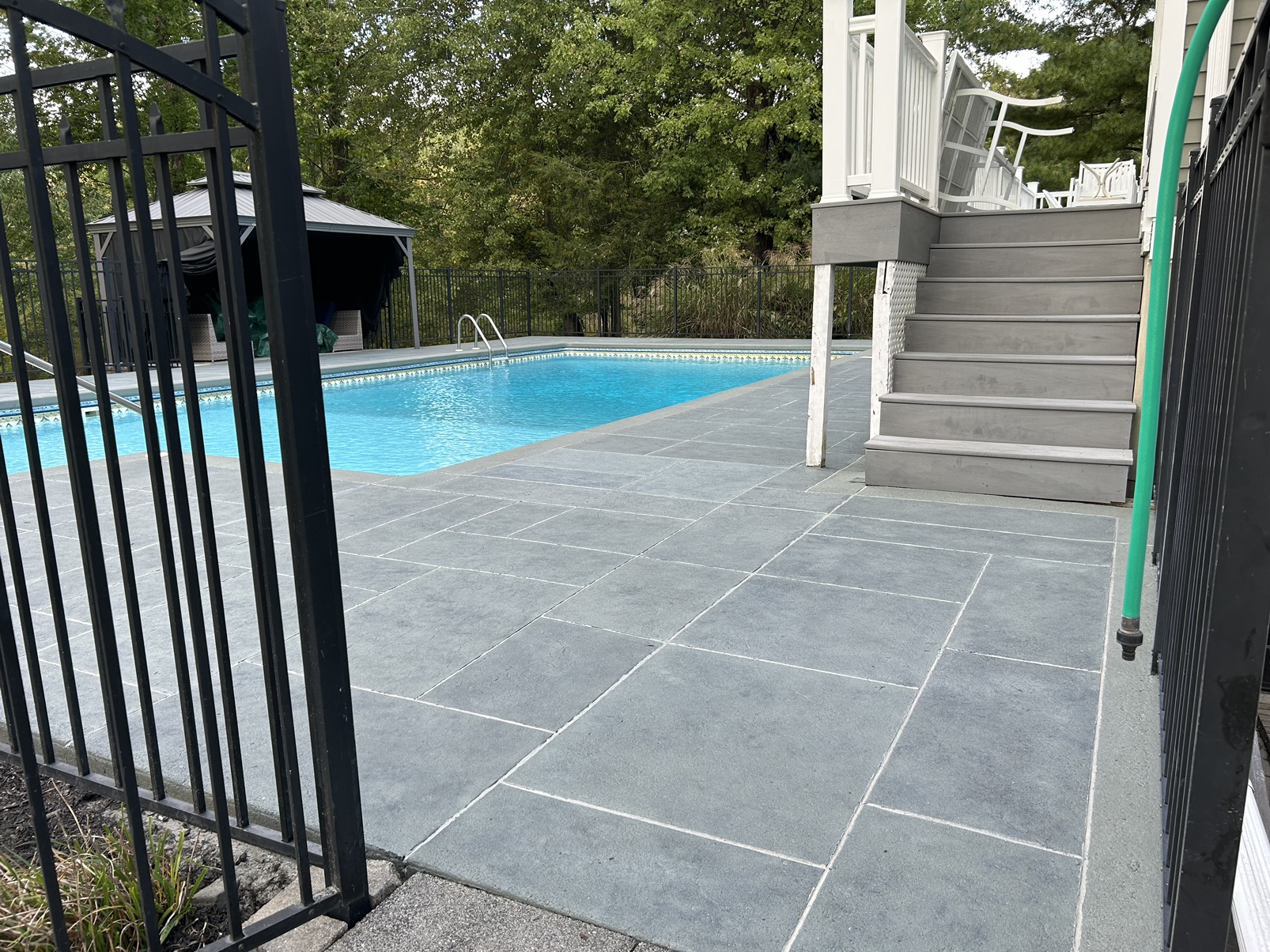 Decorative pool deck resurfacing project using Granite Slate tile finish
