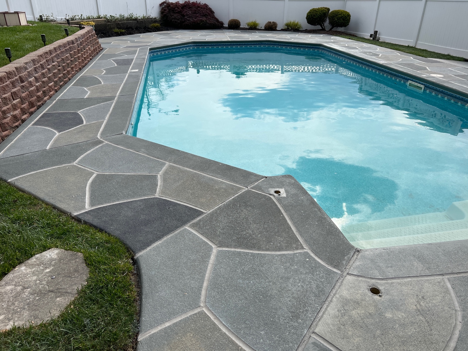 Granite Slate pool deck concrete repair and resurfacing project.