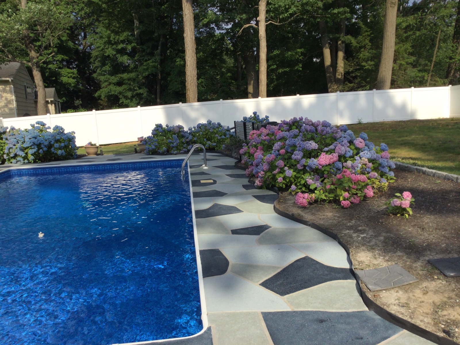 Granite Slate decorative concrete pool deck surface with stone inspired pattern.