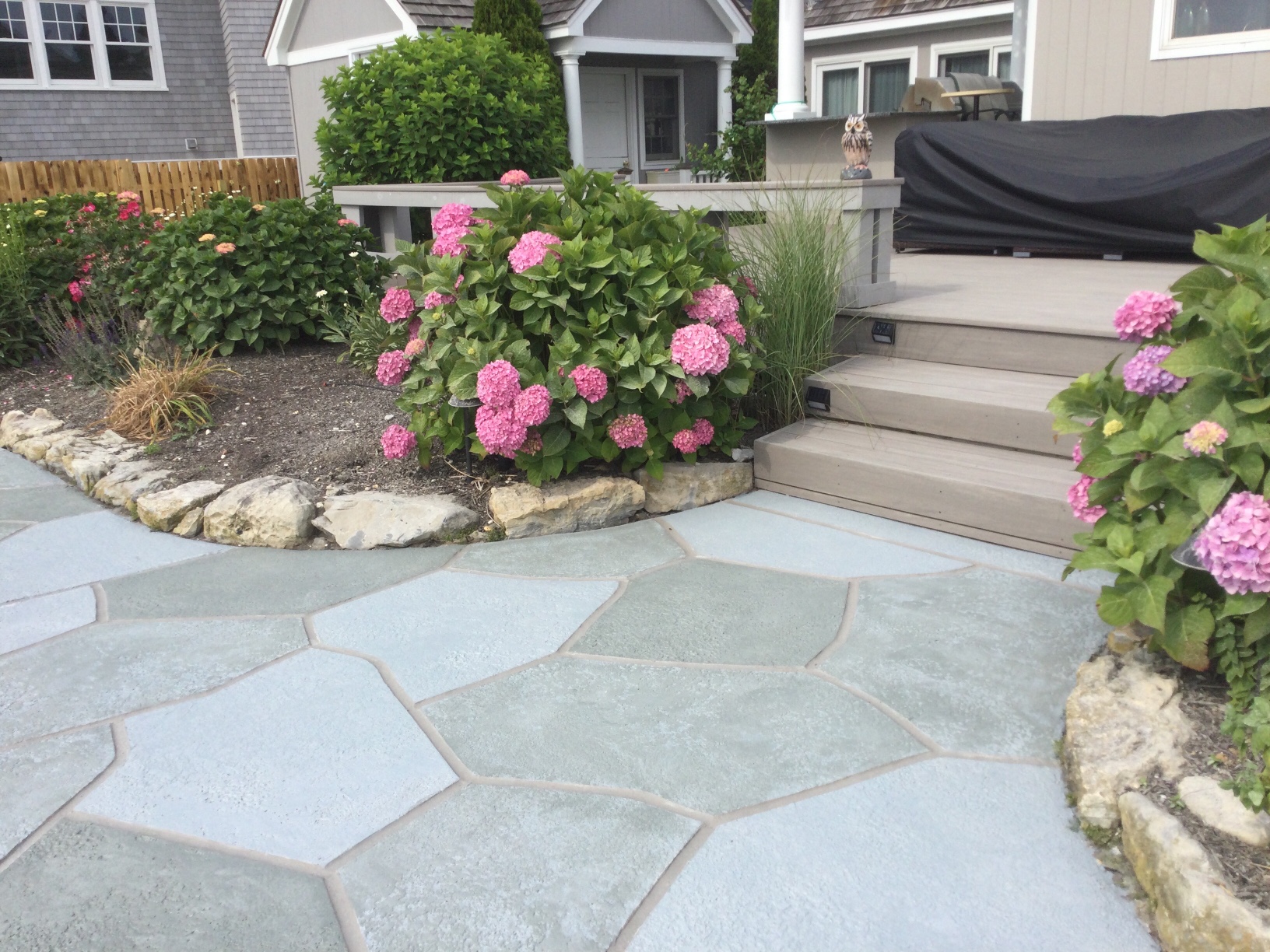 Residential pool deck in Granite Slate color theme after concrete resurfacing.