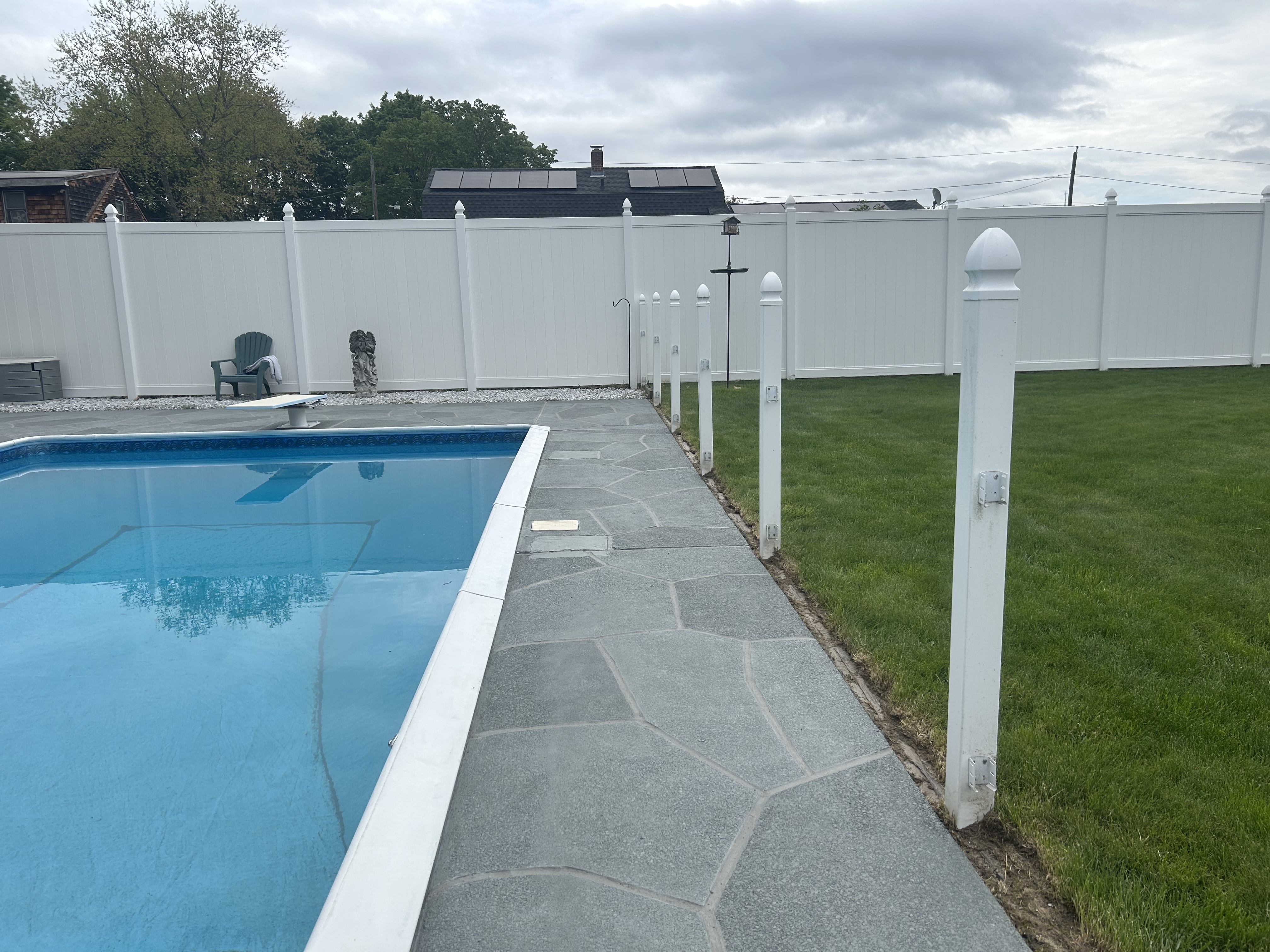 Resurfaced concrete pool deck in Granite Slate finish showing modern gray stone appearance.