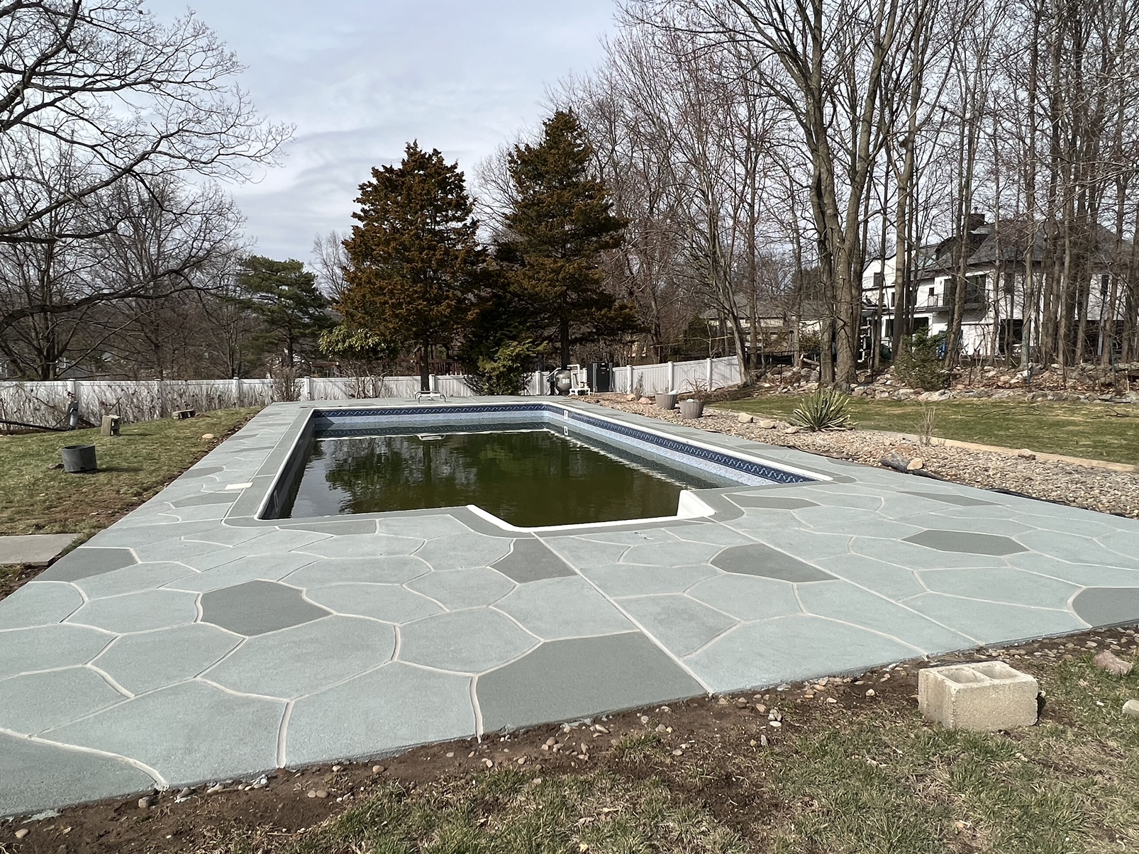Granite Slate pool deck concrete resurfacing project with refined slate like texture.