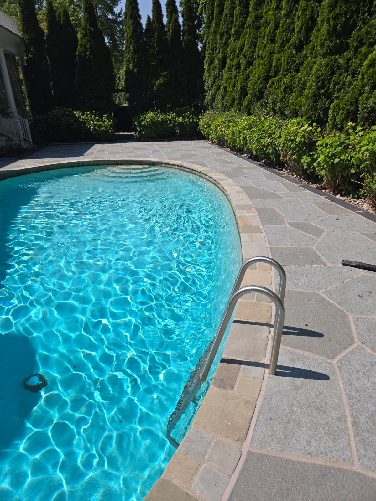 Granite Slate pool deck concrete repair and resurfacing project.