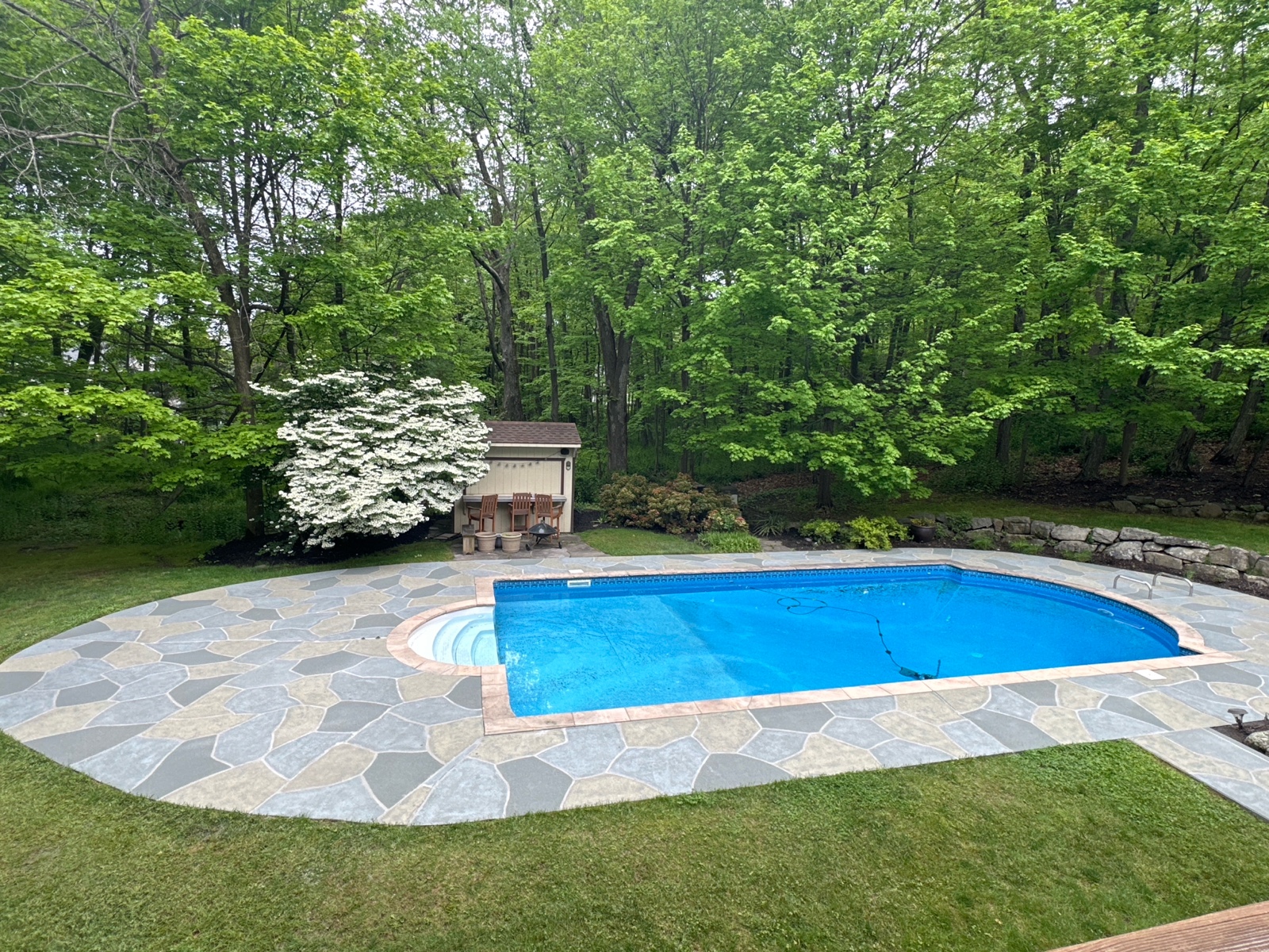 Granite Slate decorative concrete pool deck surface with stone inspired pattern.