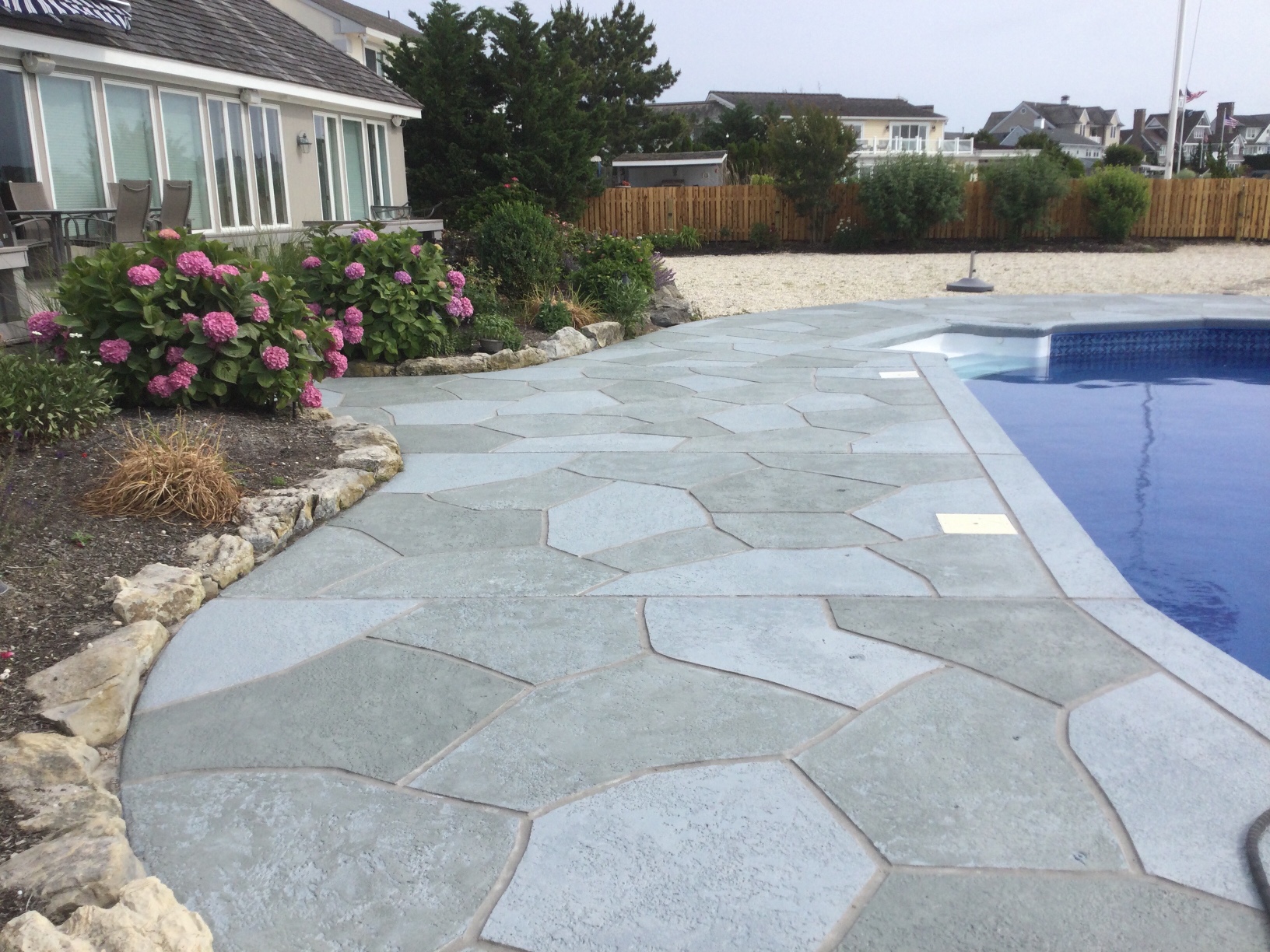 Granite Slate pool deck concrete repair and resurfacing project in Stamford, CT.