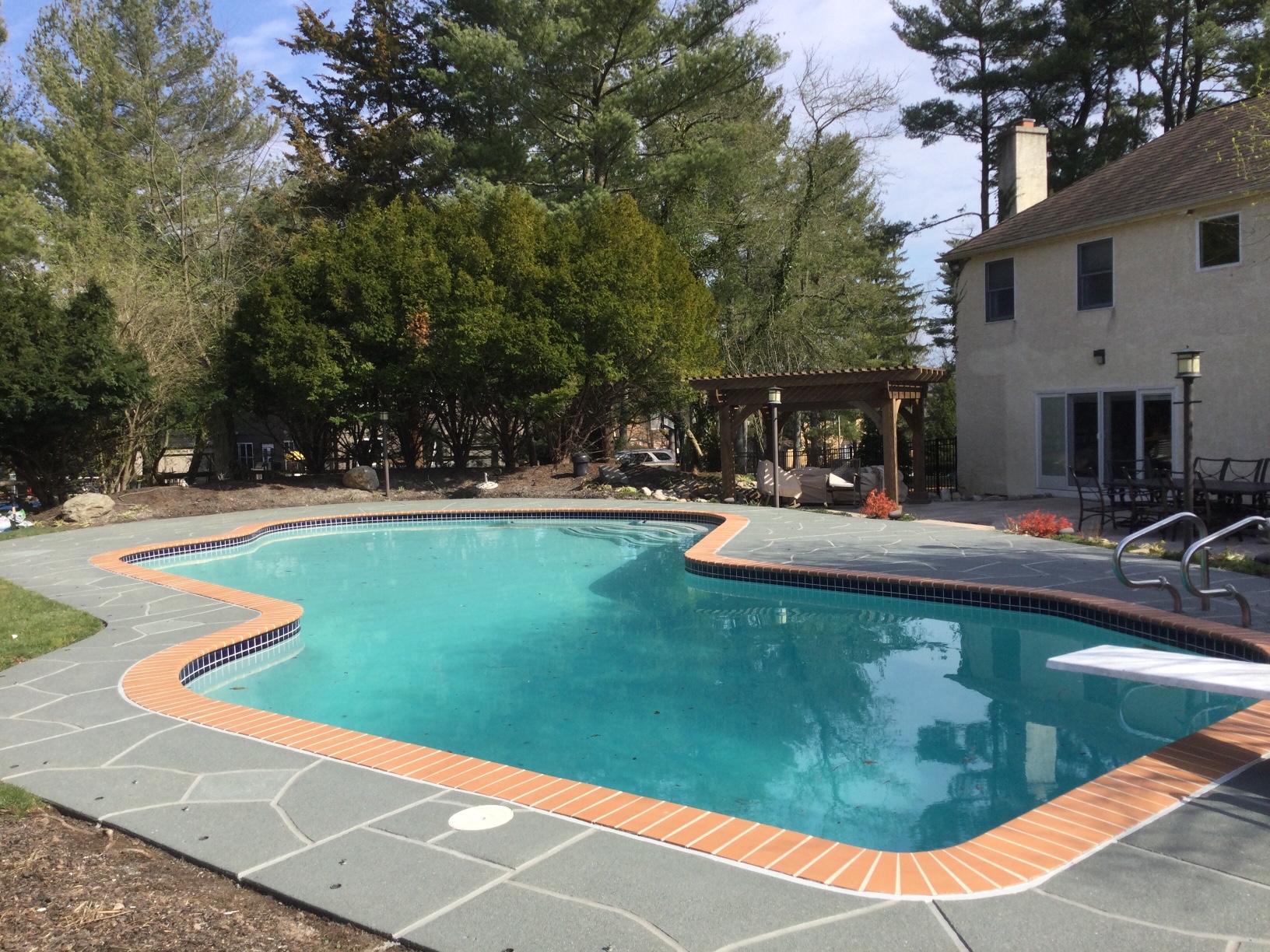 Granite Slate pool deck concrete repair and resurfacing project.