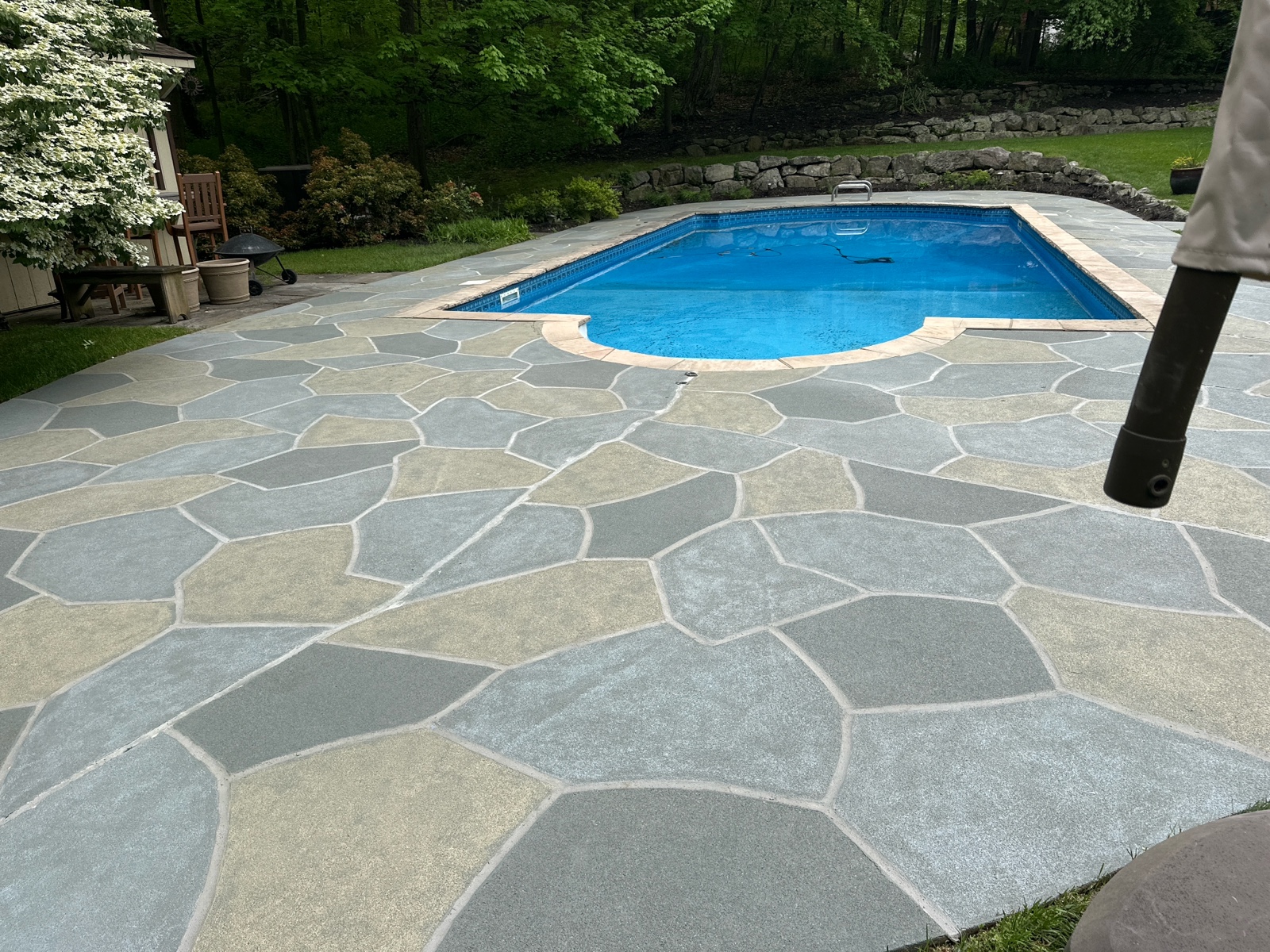Resurfaced concrete pool deck in Granite Slate finish in Marlton, NJ showing modern gray stone appearance.