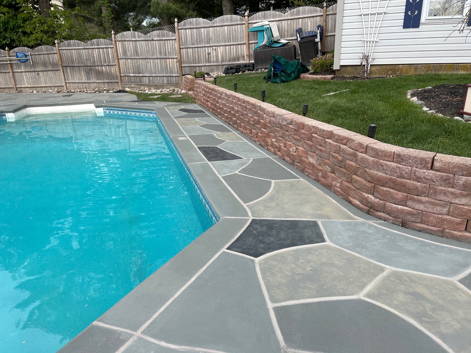 Granite Slate pool deck concrete repair and resurfacing project.
