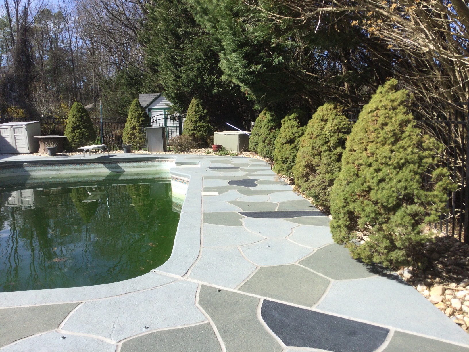 Granite Slate decorative concrete pool deck surface with stone inspired pattern.
