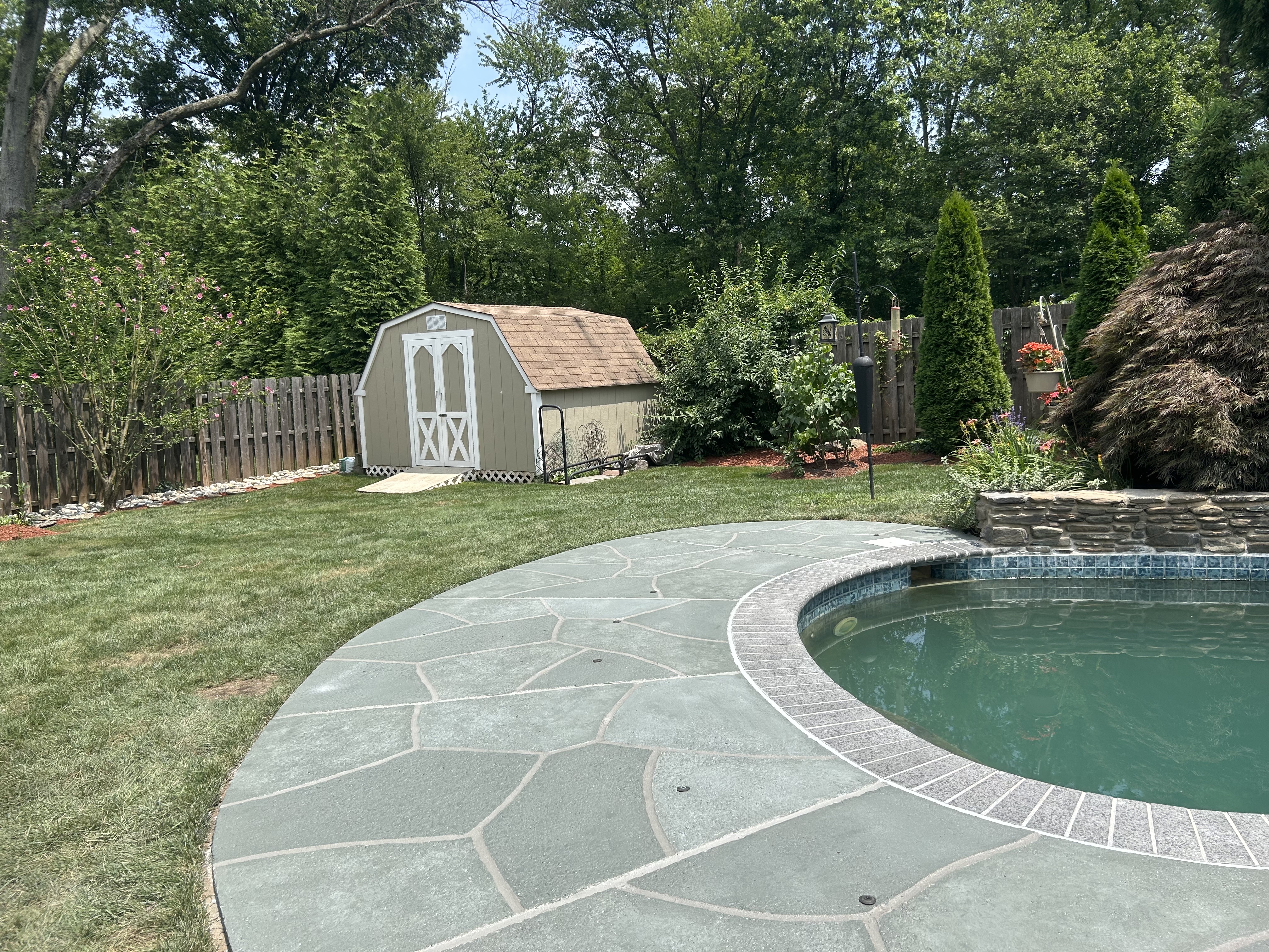 Granite Slate pool deck concrete resurfacing project with refined slate like texture.