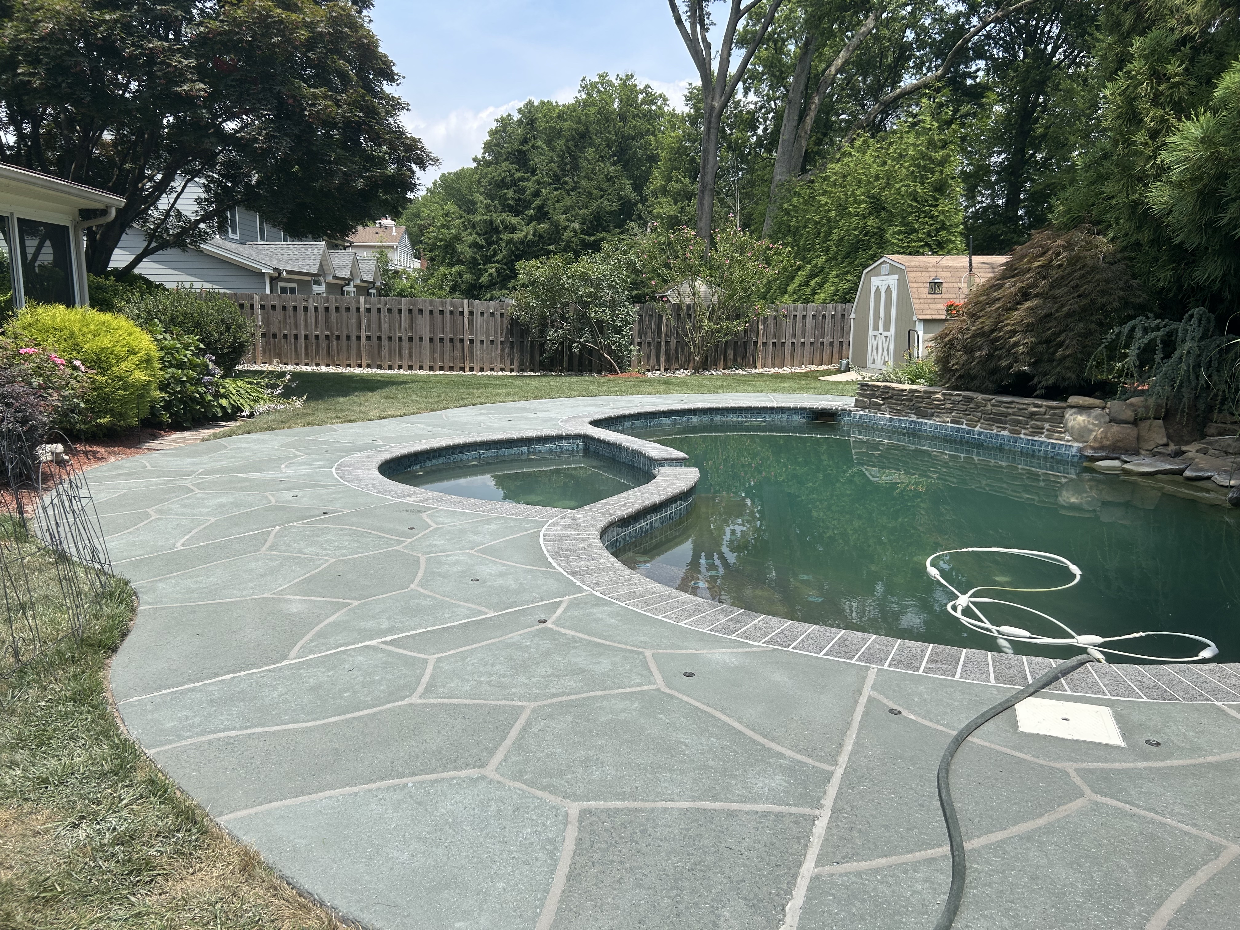 Granite Slate decorative concrete pool deck surface in Annapolis, MD with stone inspired pattern.
