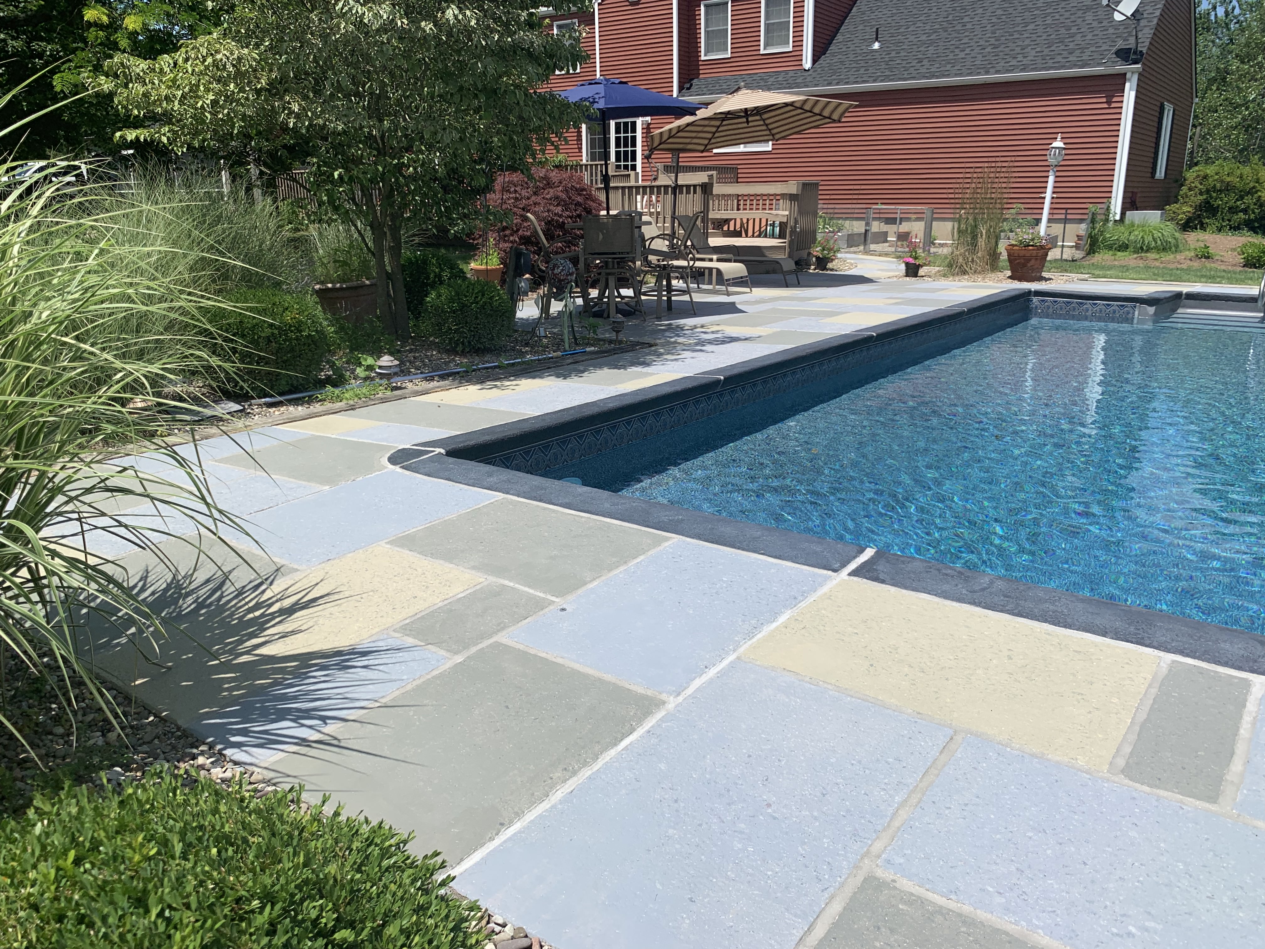 Granite Slate pool deck concrete repair and resurfacing project in Stamford, CT.