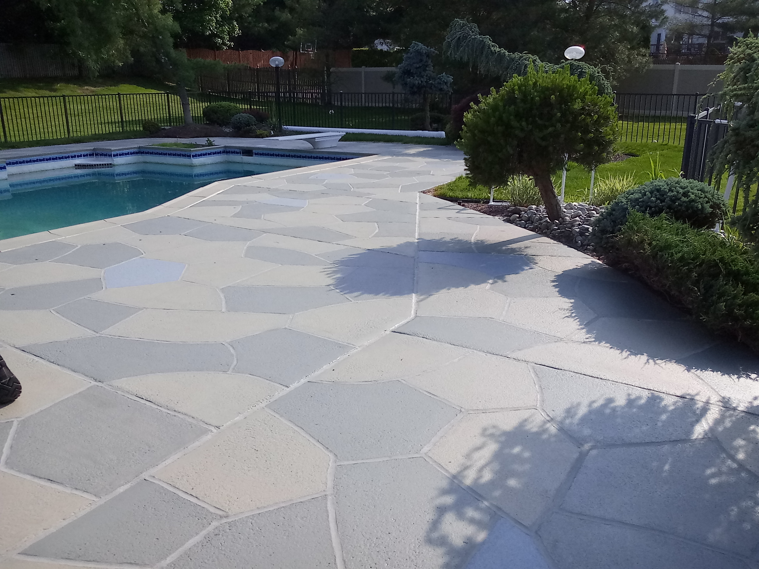 Granite Slate pool deck concrete resurfacing project in Summit, NJ with refined slate like texture.