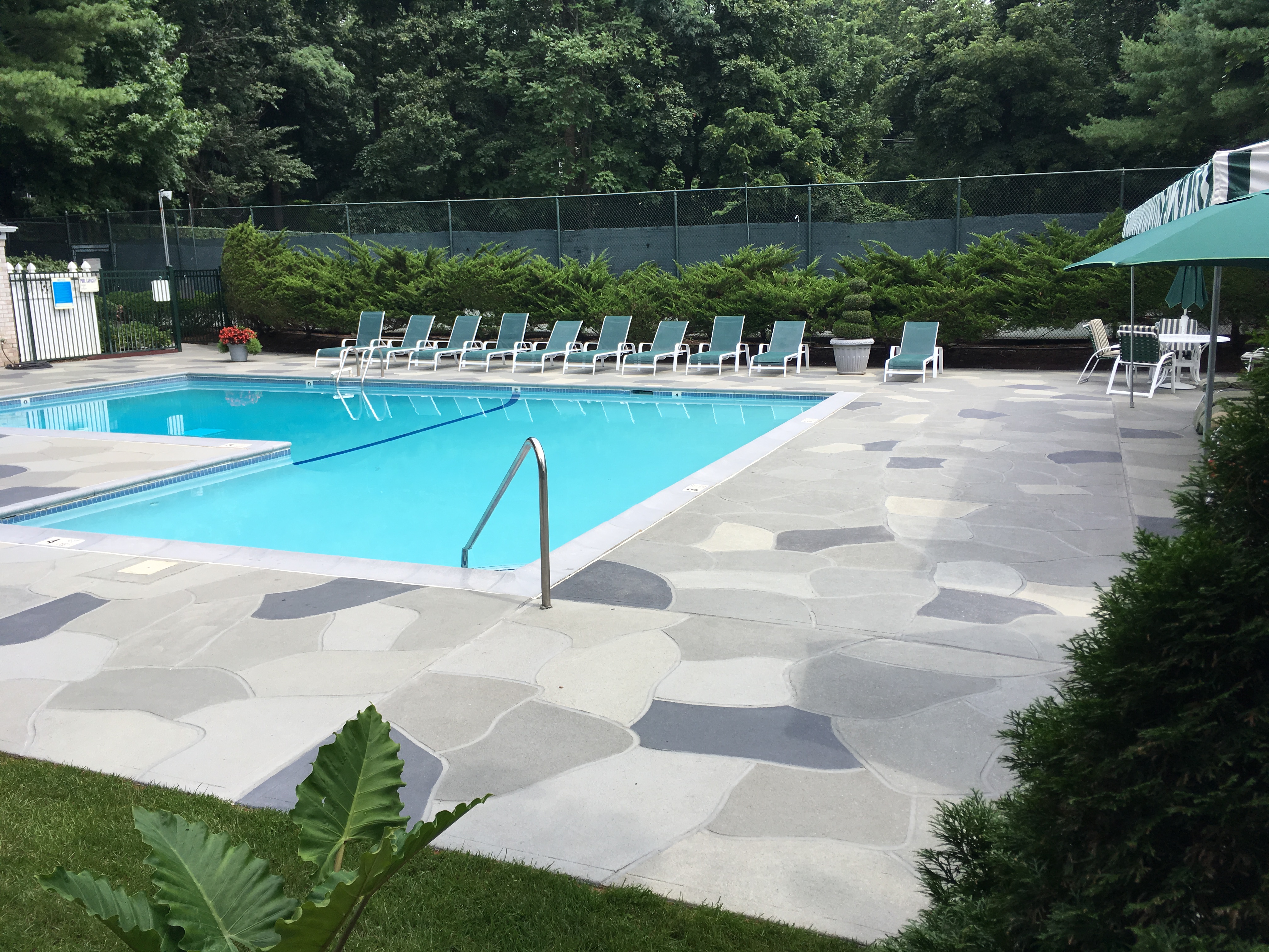 Granite Slate pool deck concrete resurfacing project in Plymouth, MA with refined slate like texture.