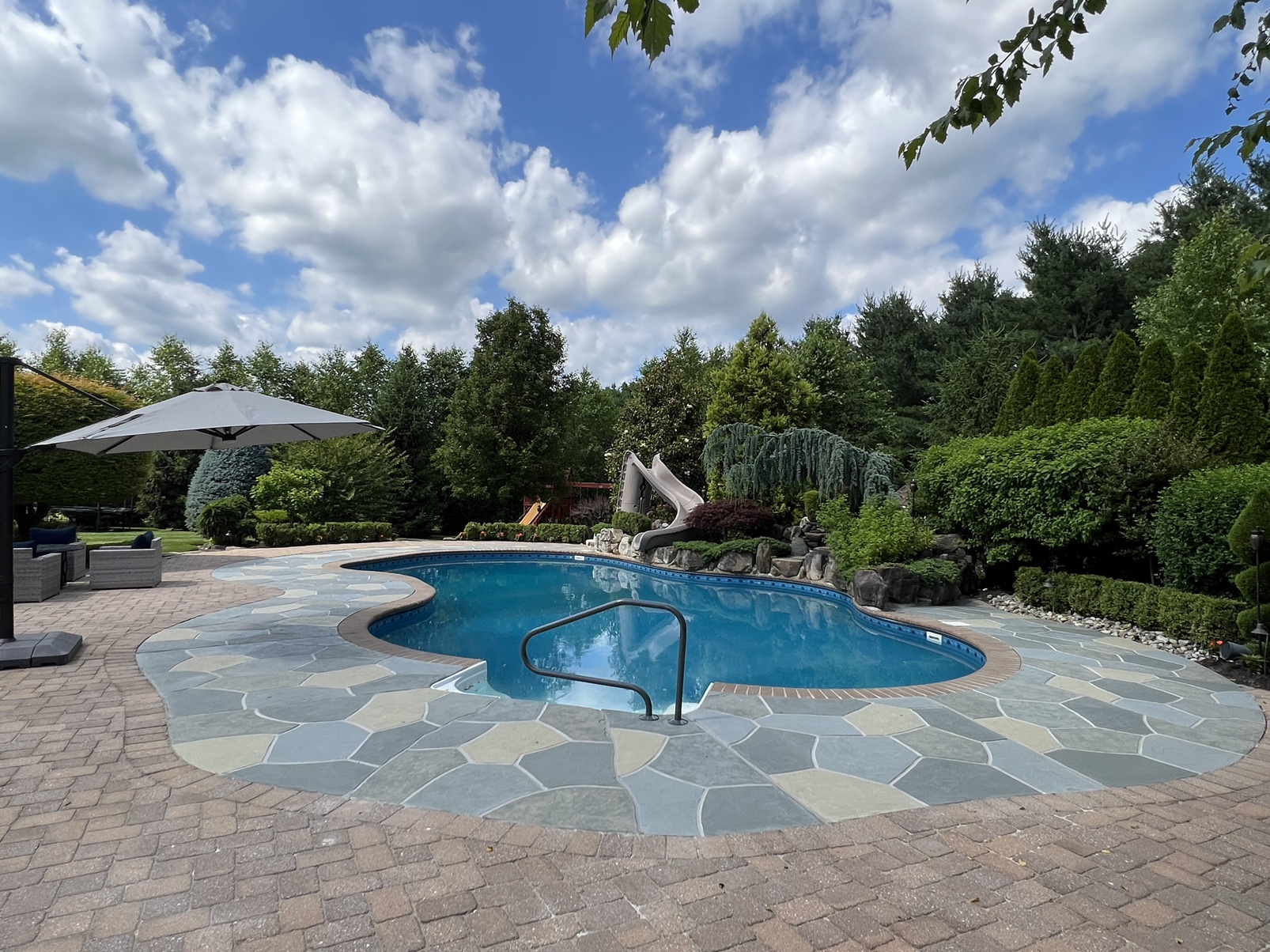 Granite Slate pool deck concrete repair and resurfacing project.