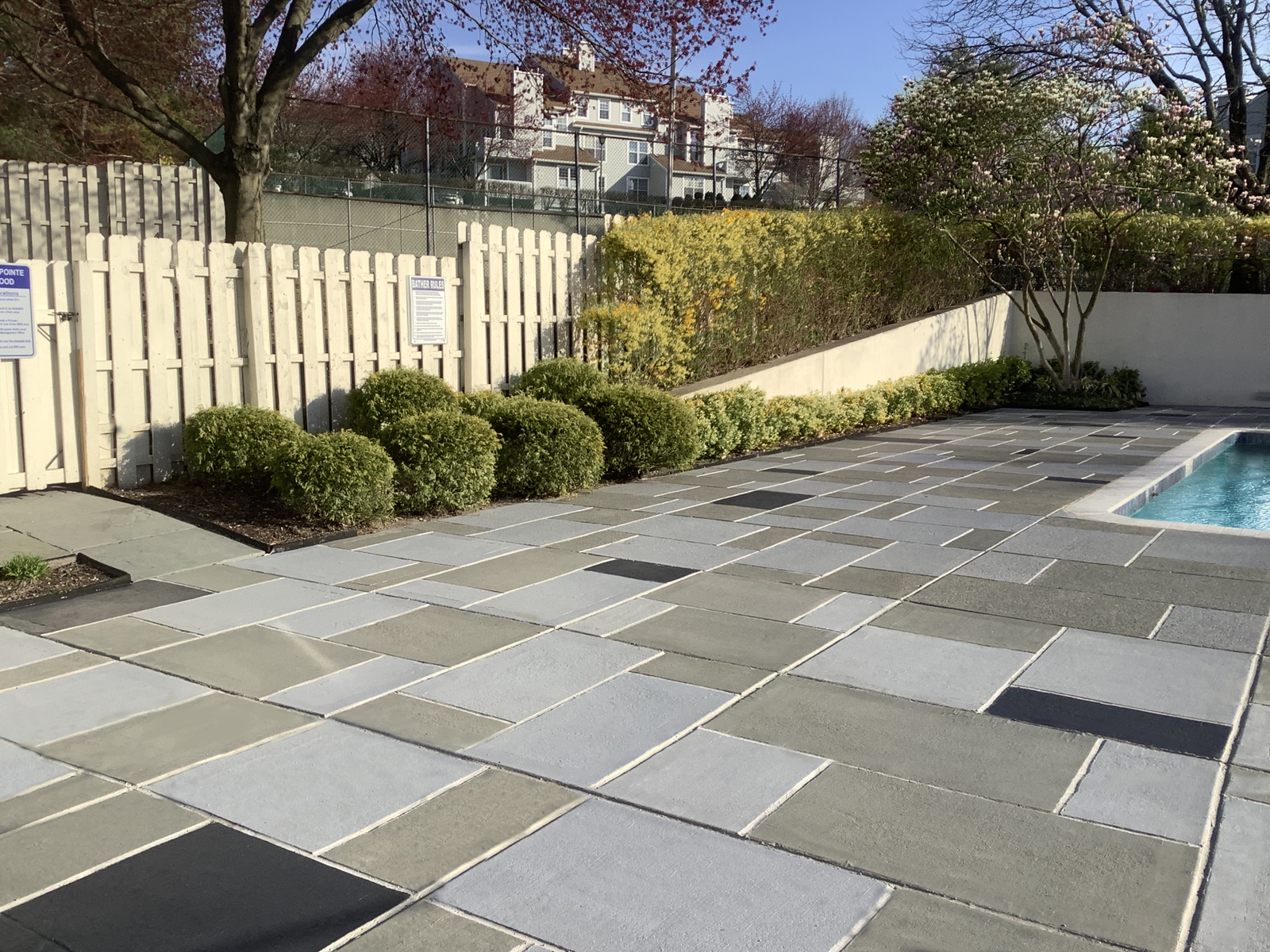 Residential pool deck in Granite Slate color theme in Plymouth, MA after concrete resurfacing.