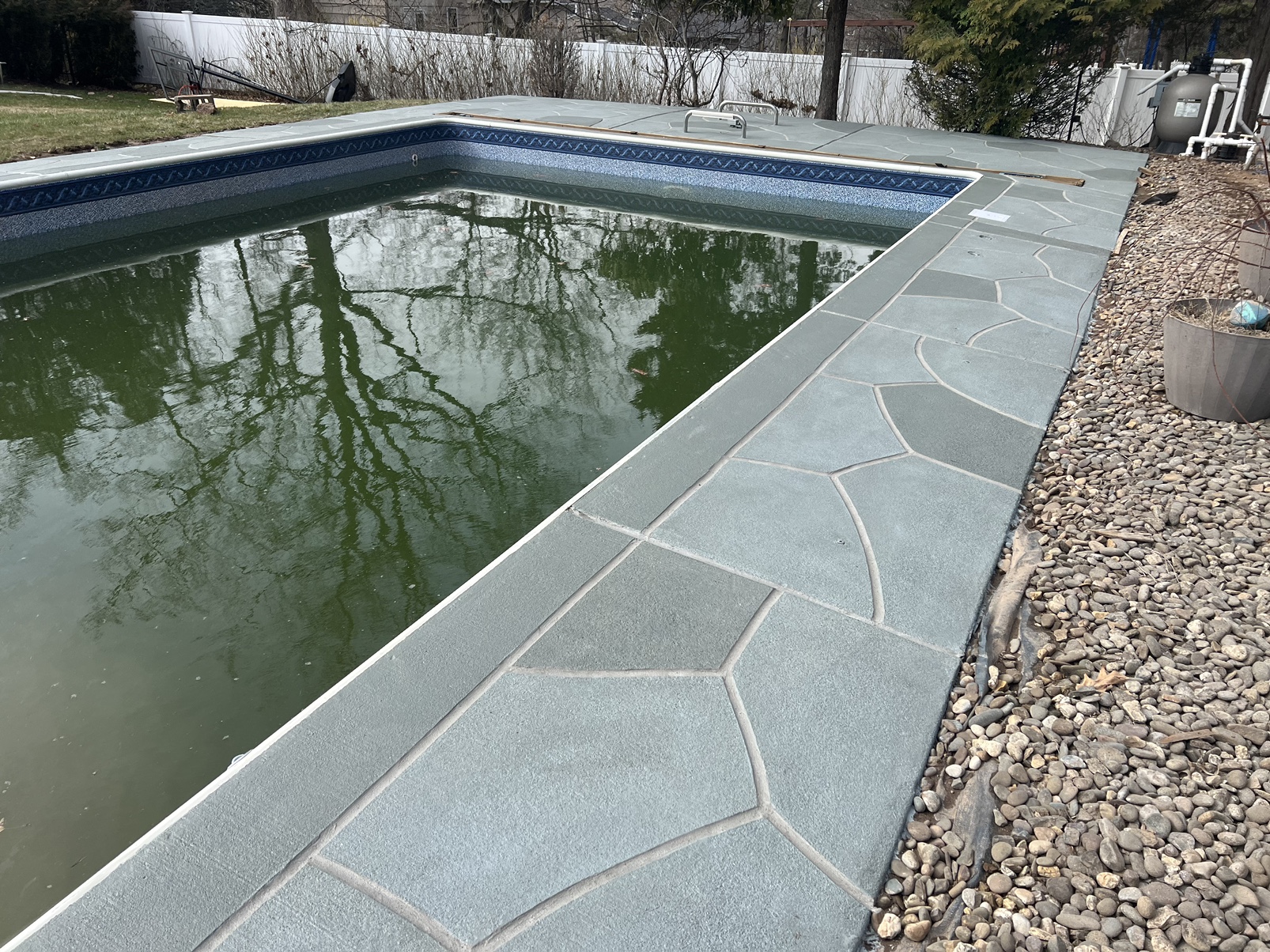Granite Slate pool deck concrete resurfacing project with refined slate like texture.