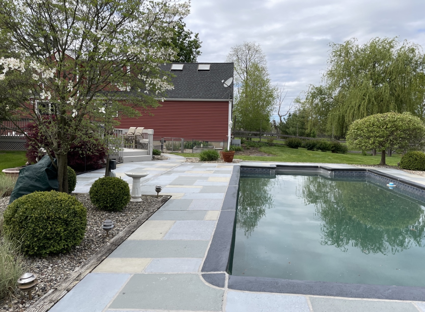 Upgraded concrete pool deck in Granite Slate finish in Summit, NJ with clean gray slate look.