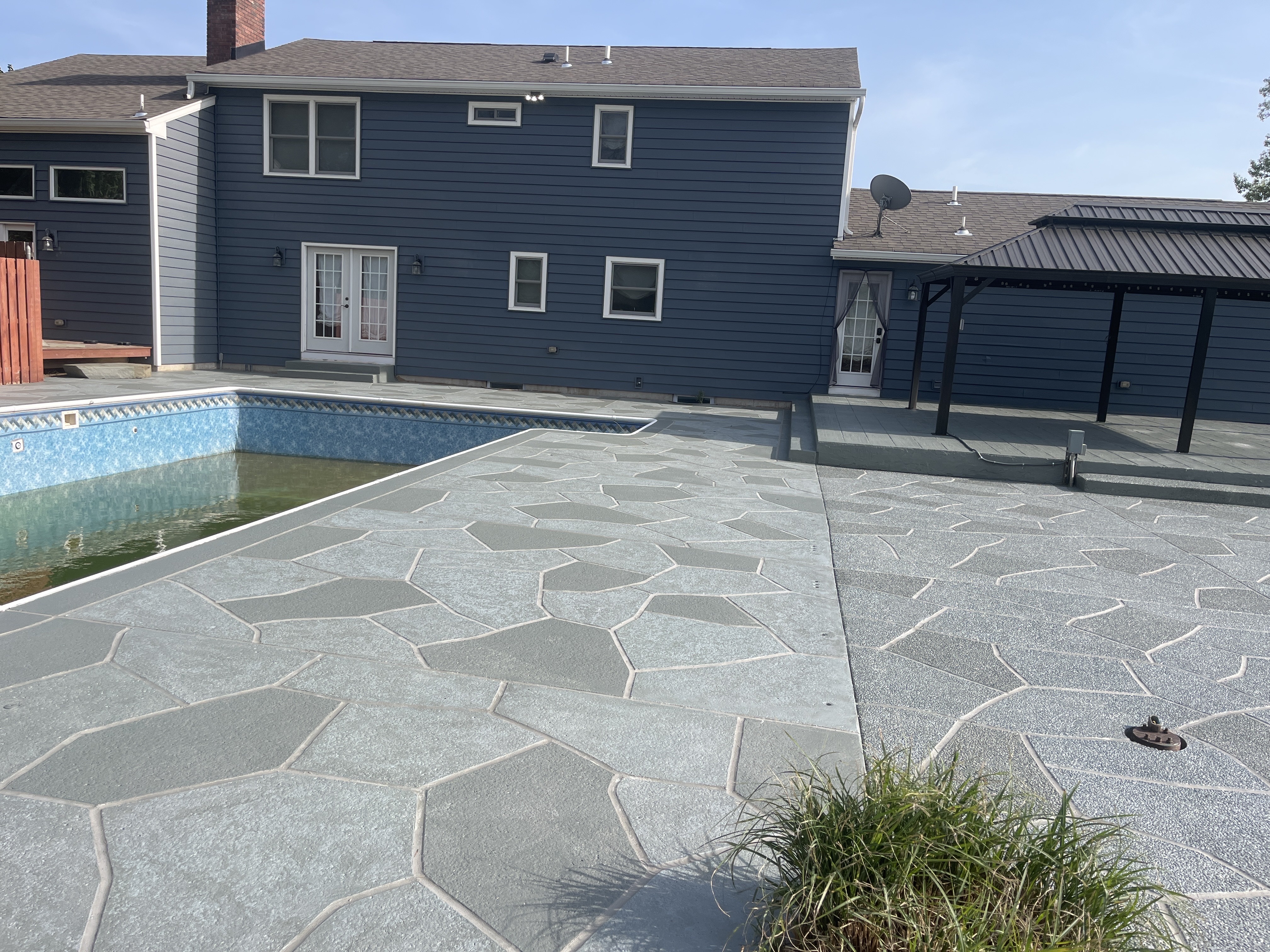 Granite Slate pool deck concrete resurfacing project with refined slate like texture.