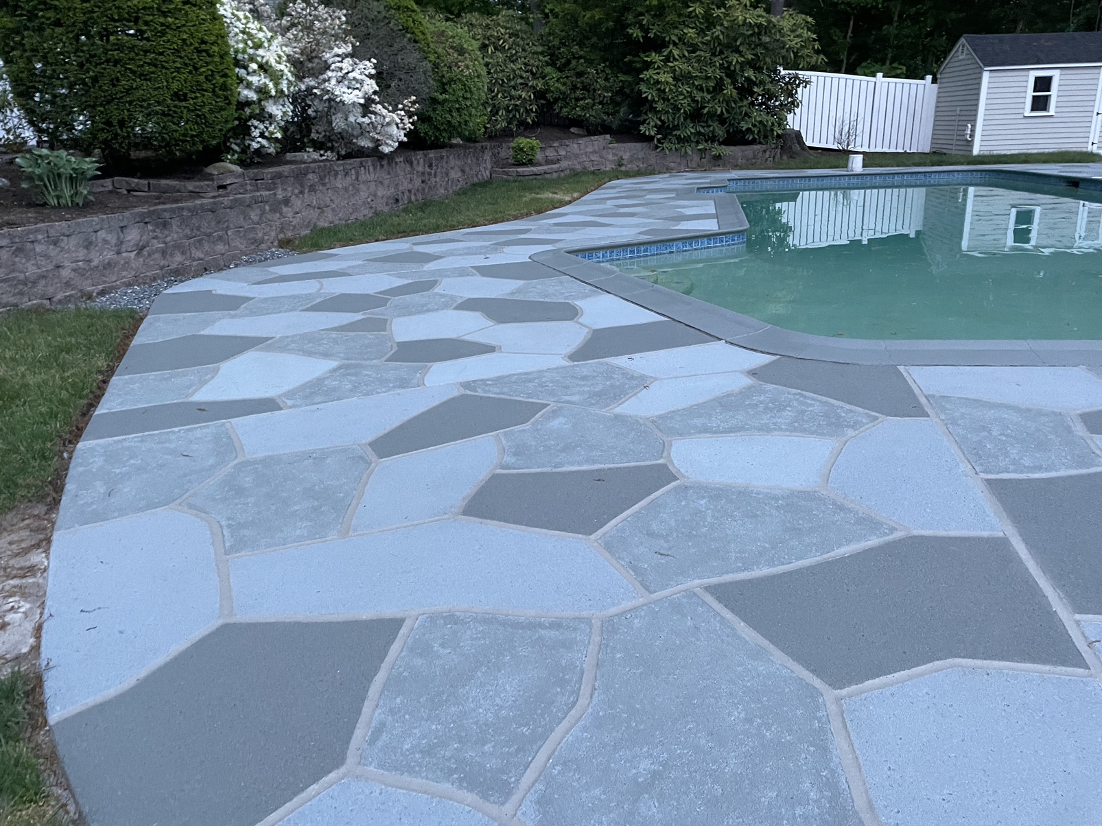 Granite Slate decorative concrete pool deck surface with stone inspired pattern.