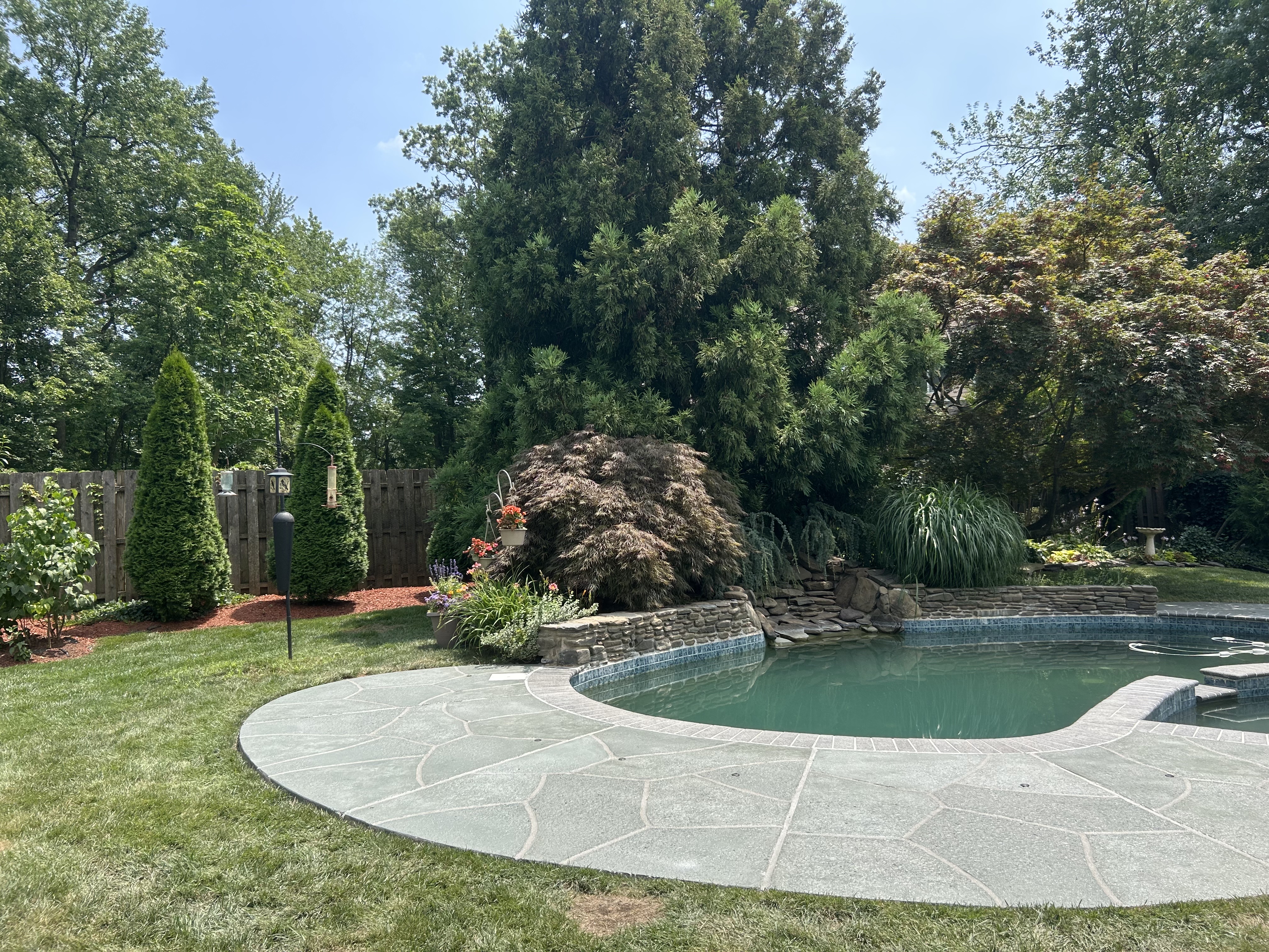 Granite Slate decorative concrete pool deck surface in Summit, NJ with stone inspired pattern.