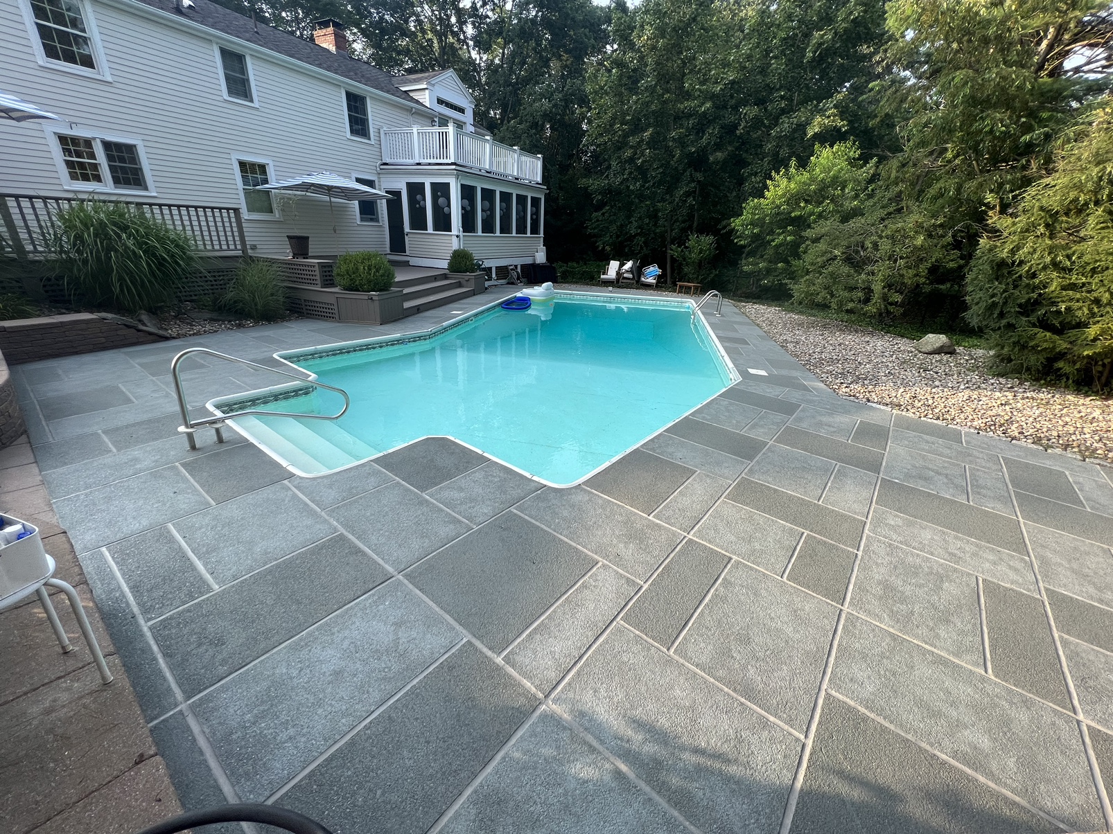 Granite Slate tile style concrete pool deck with modern gray stone look